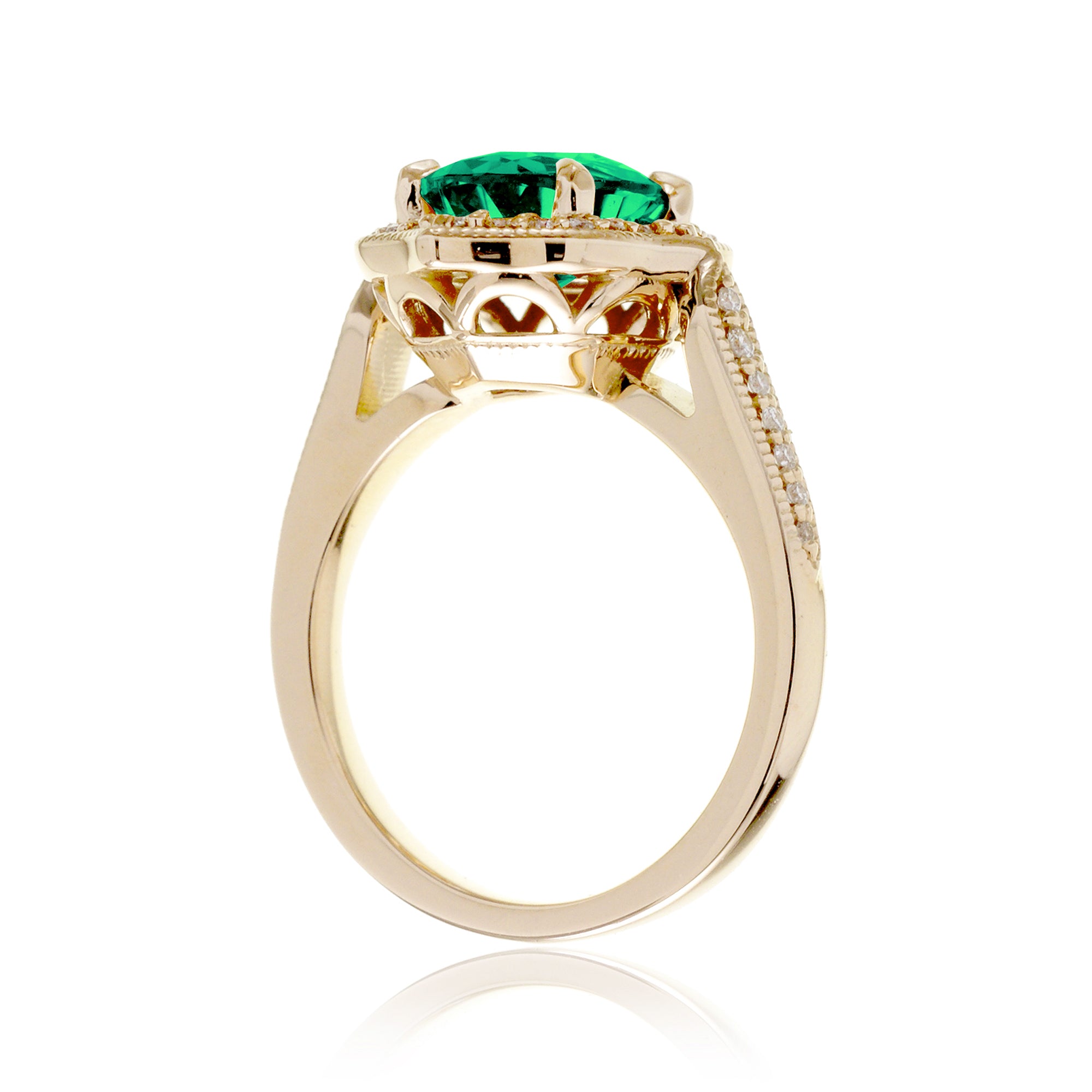 Vintage Oval Emerald and Diamond Halo Ring in Yellow Gold