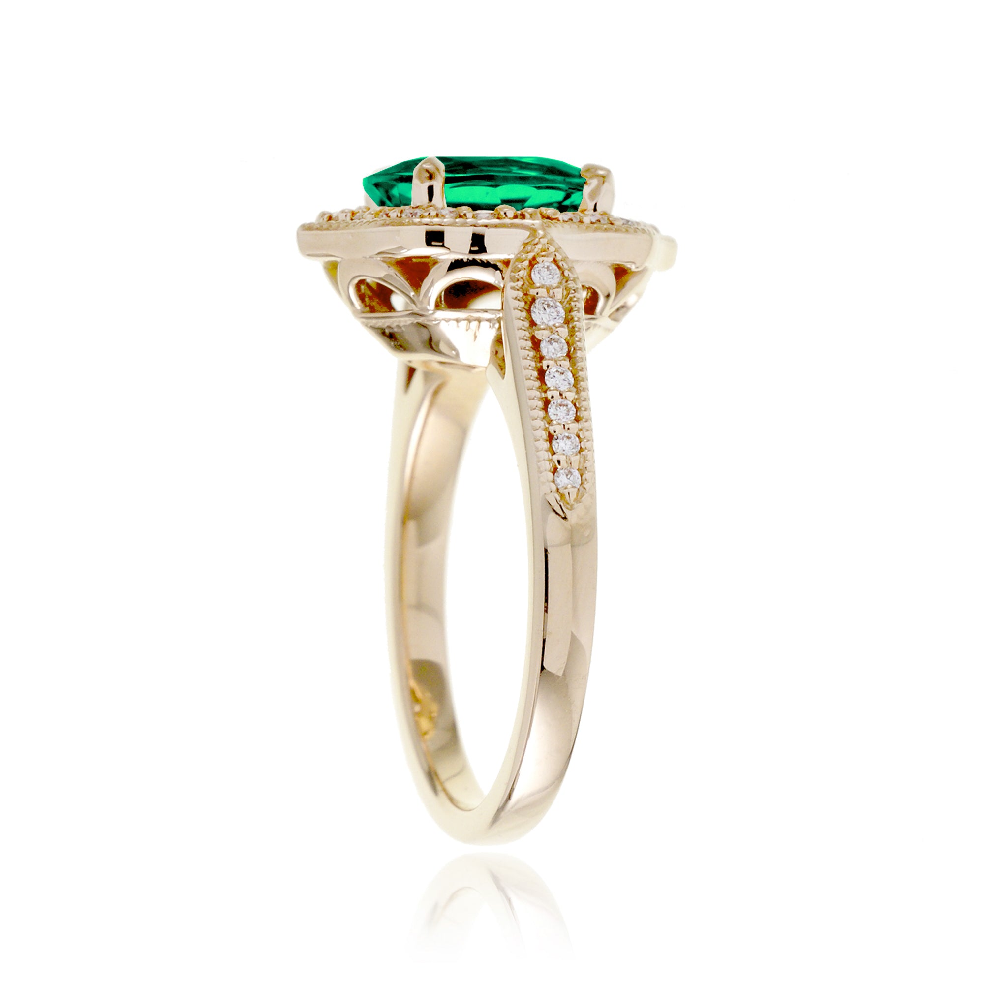 Vintage Oval Emerald and Diamond Halo Ring in Yellow Gold