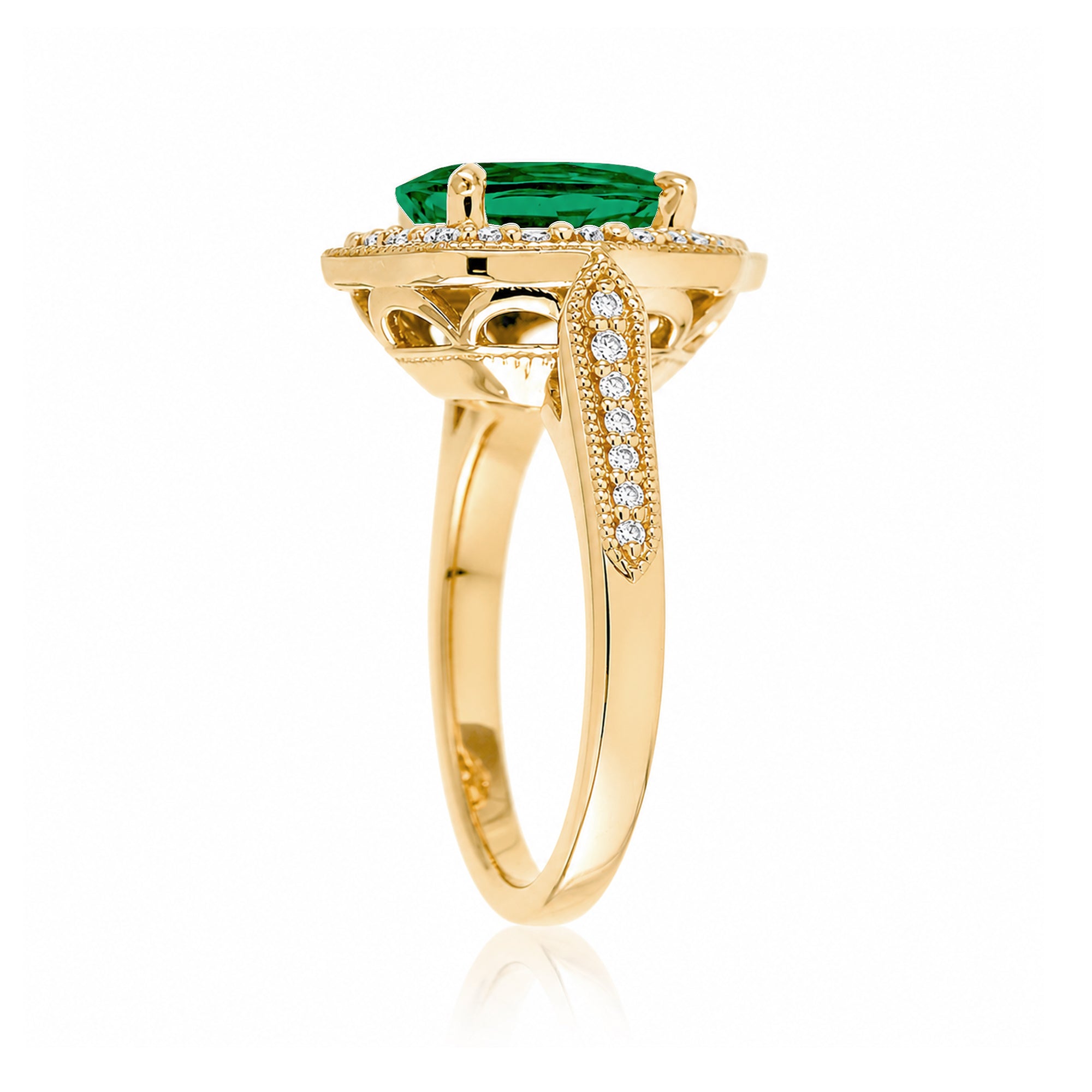 Vintage Oval Emerald and Diamond Halo Ring in Yellow Gold