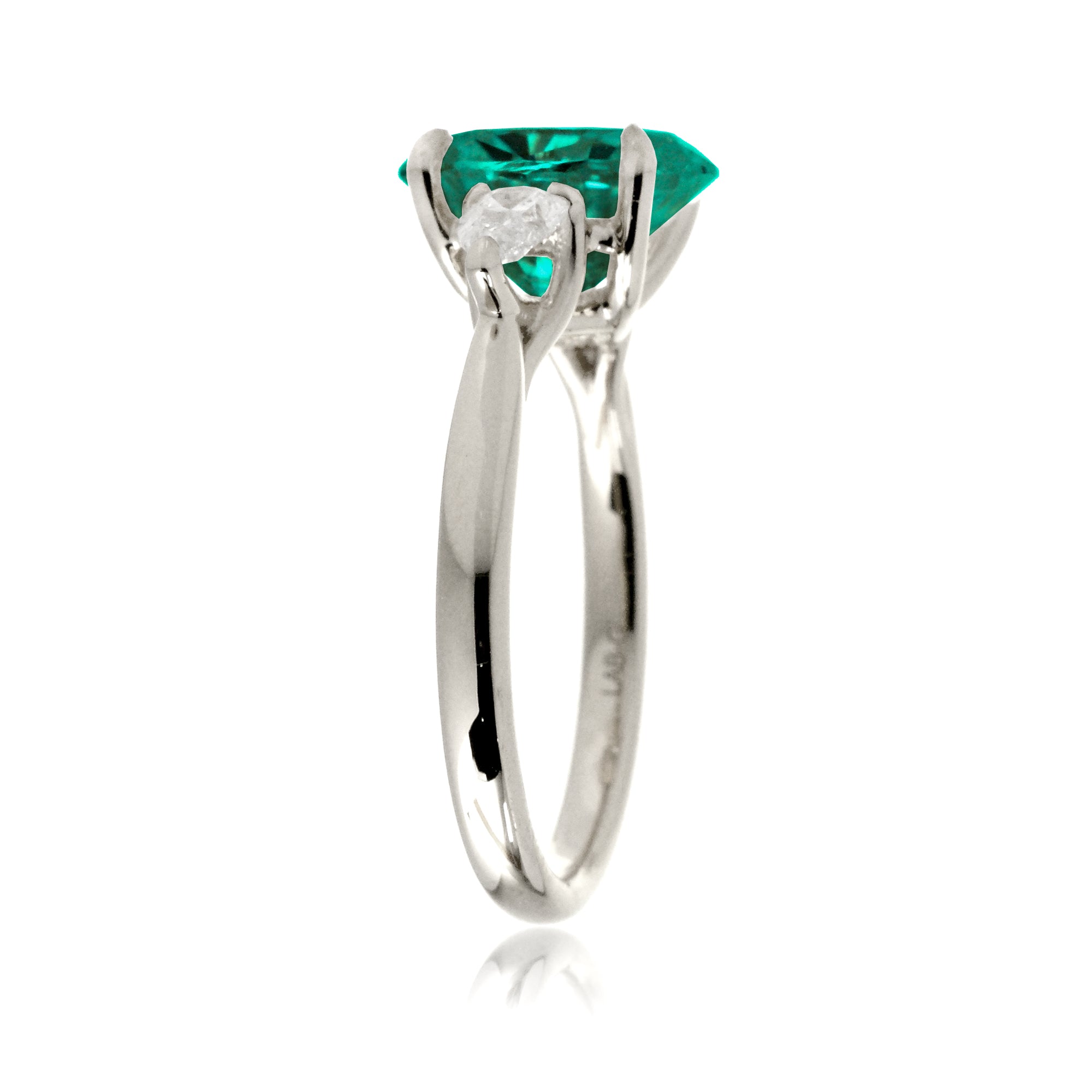 Oval cut green emerald three stone pear diamond ring white gold