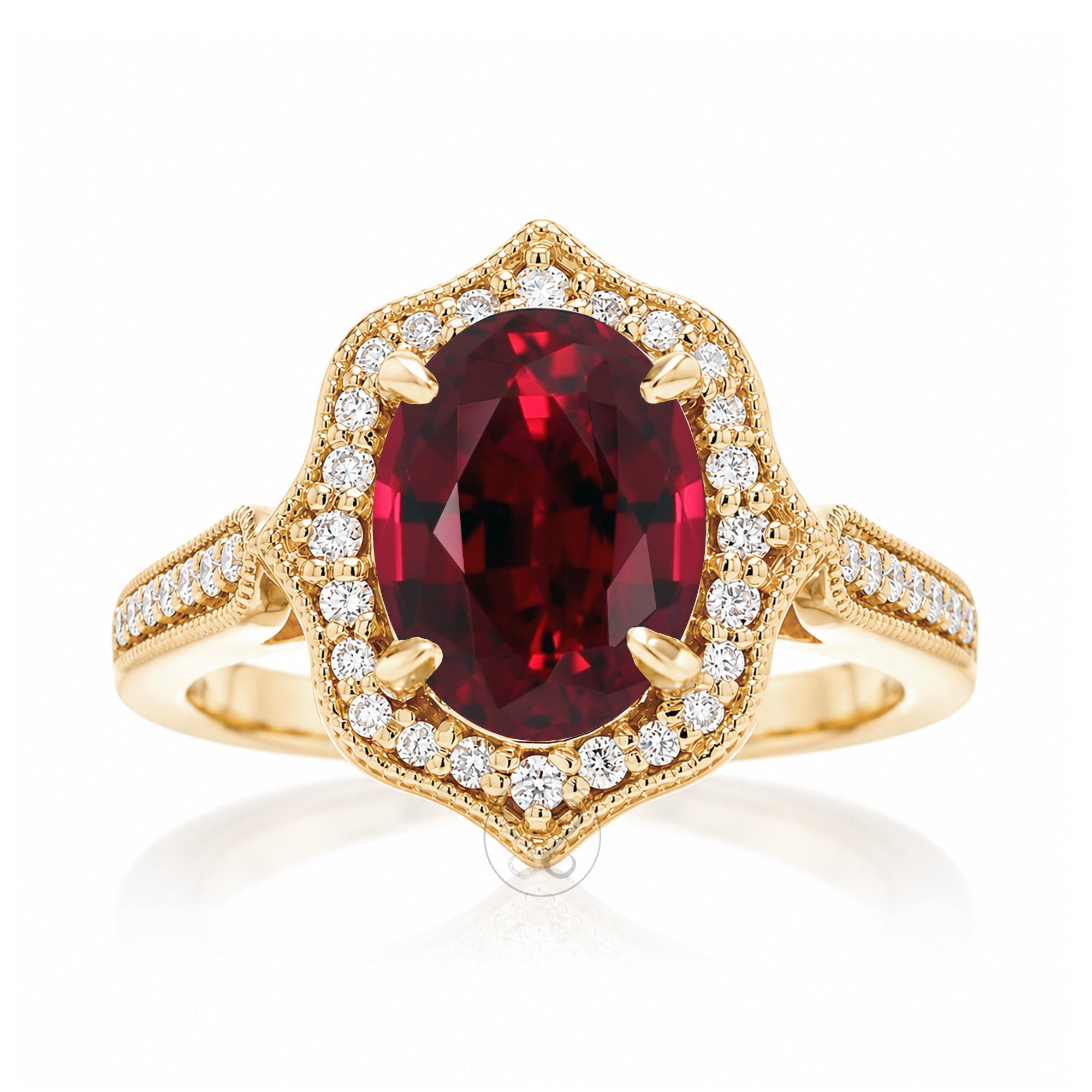 Vintage Oval Ruby and Diamond Halo Ring in Yellow Gold