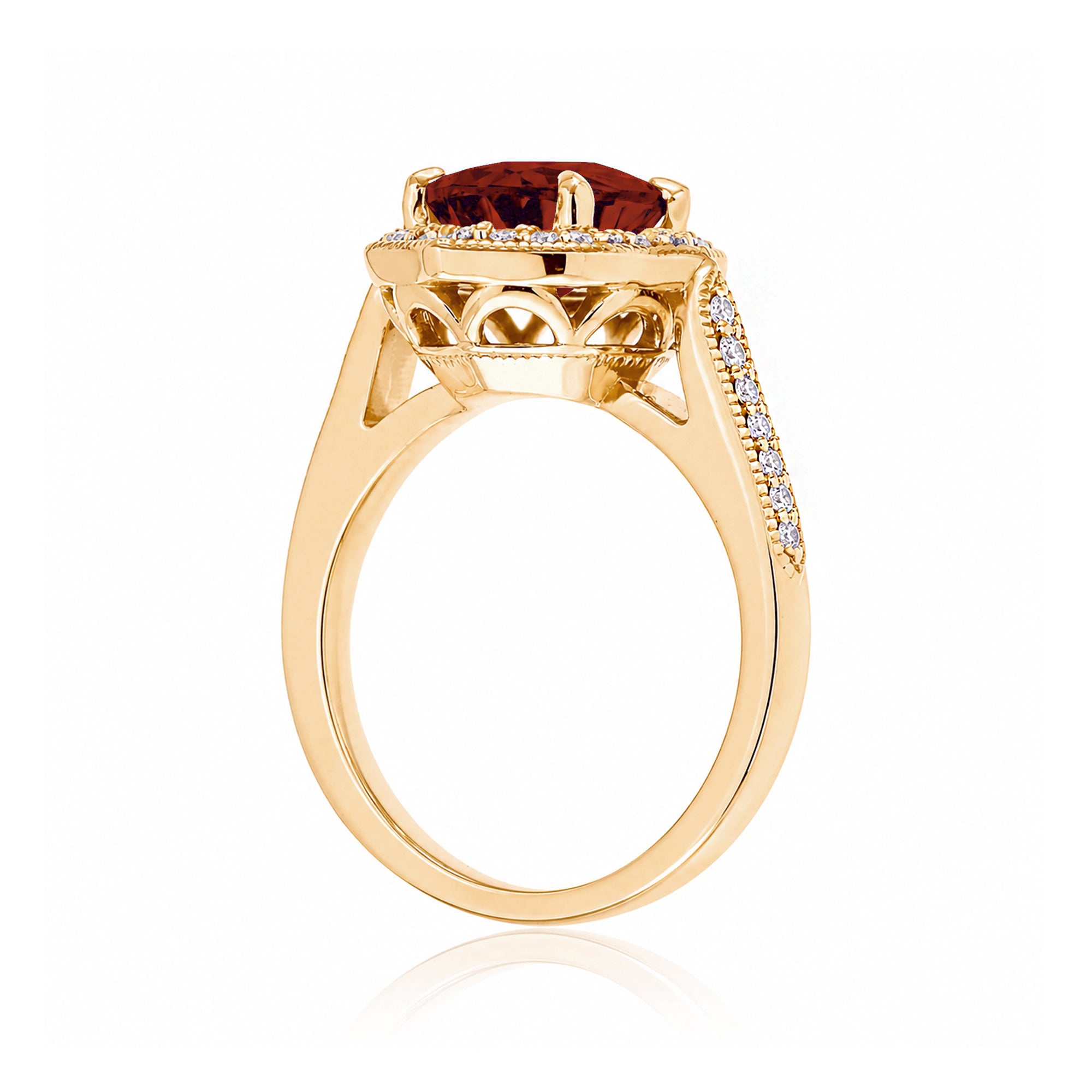 Vintage Oval Ruby and Diamond Halo Ring in Yellow Gold
