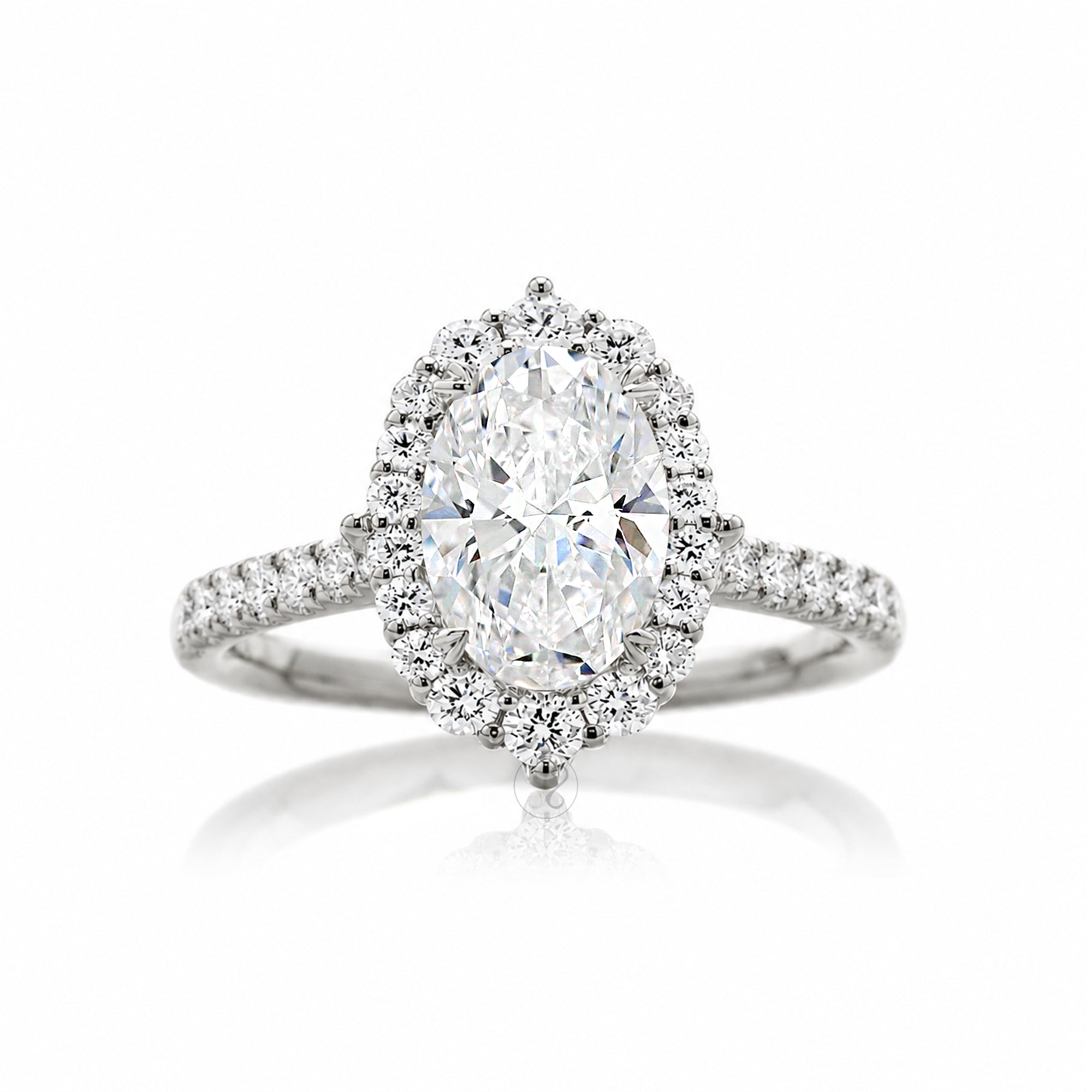 Oval diamond ring with halo and cathedral setting in white gold