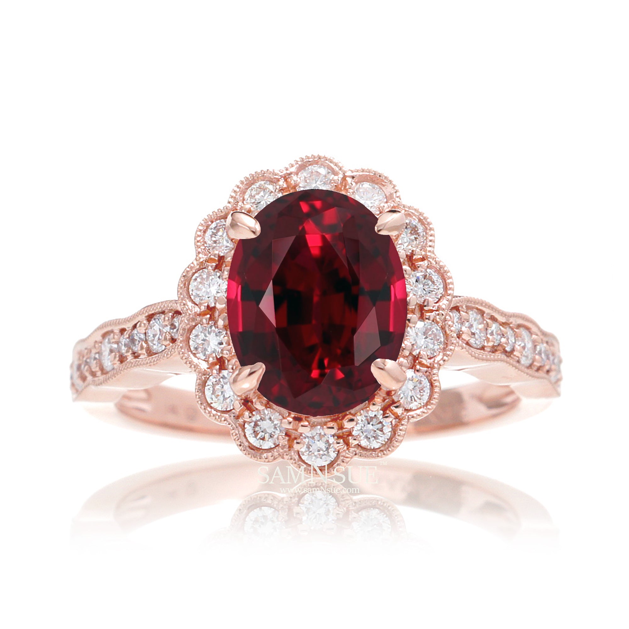 Oval cut ruby and diamond engagement ring with a vintage scallop band and halo rose gold
