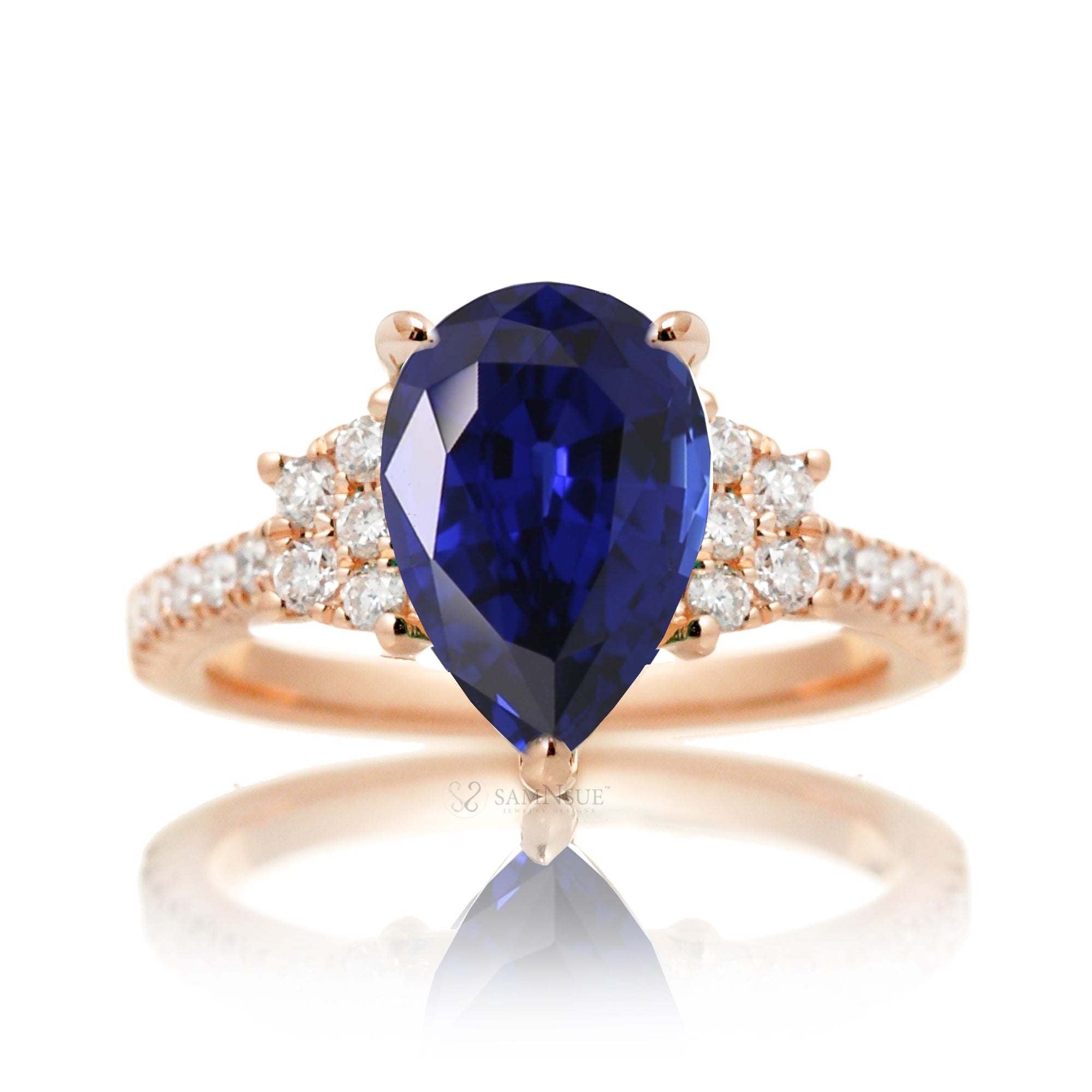 Pear blue sapphire and diamond band engagement ring in rose gold