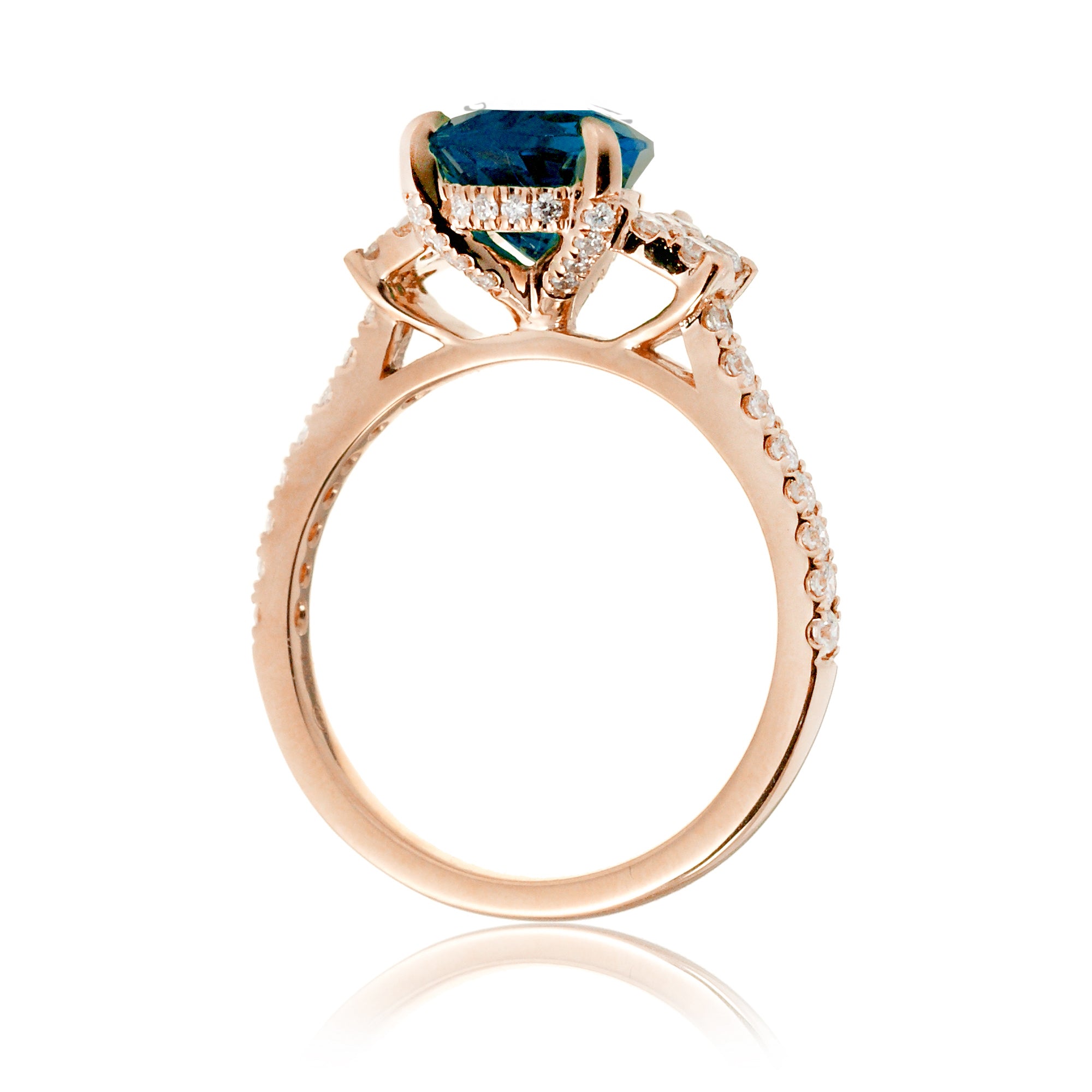 Pear blue sapphire and diamond band engagement ring in rose gold
