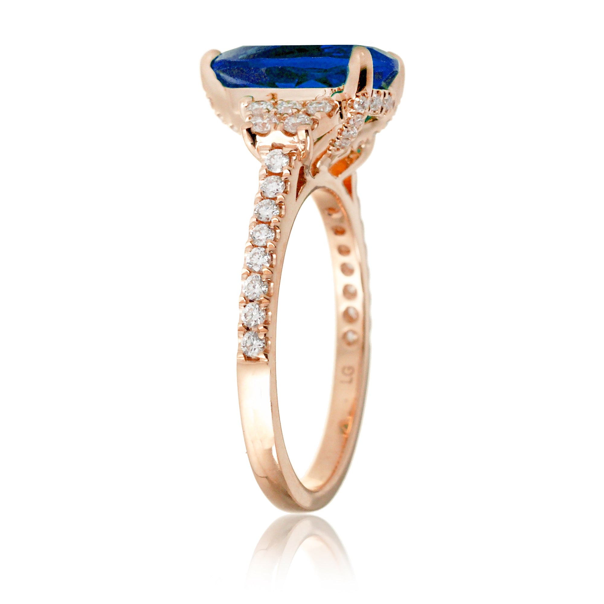 Pear blue sapphire and diamond band engagement ring in rose gold
