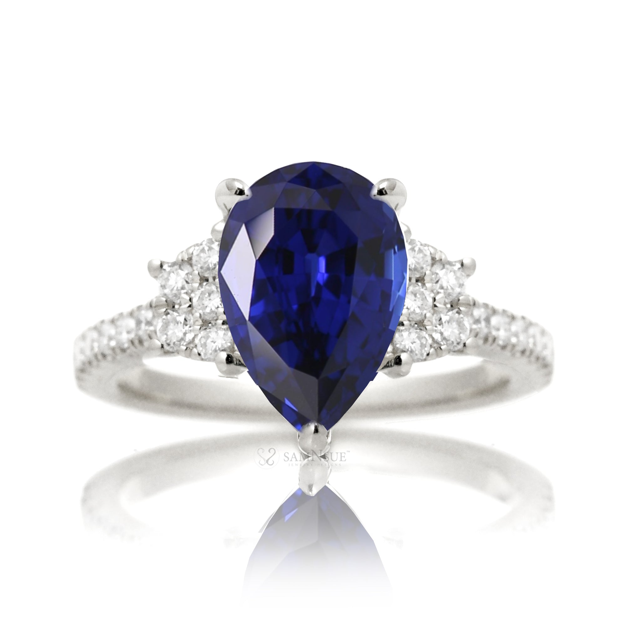 Pear blue sapphire and diamond band engagement ring in white gold