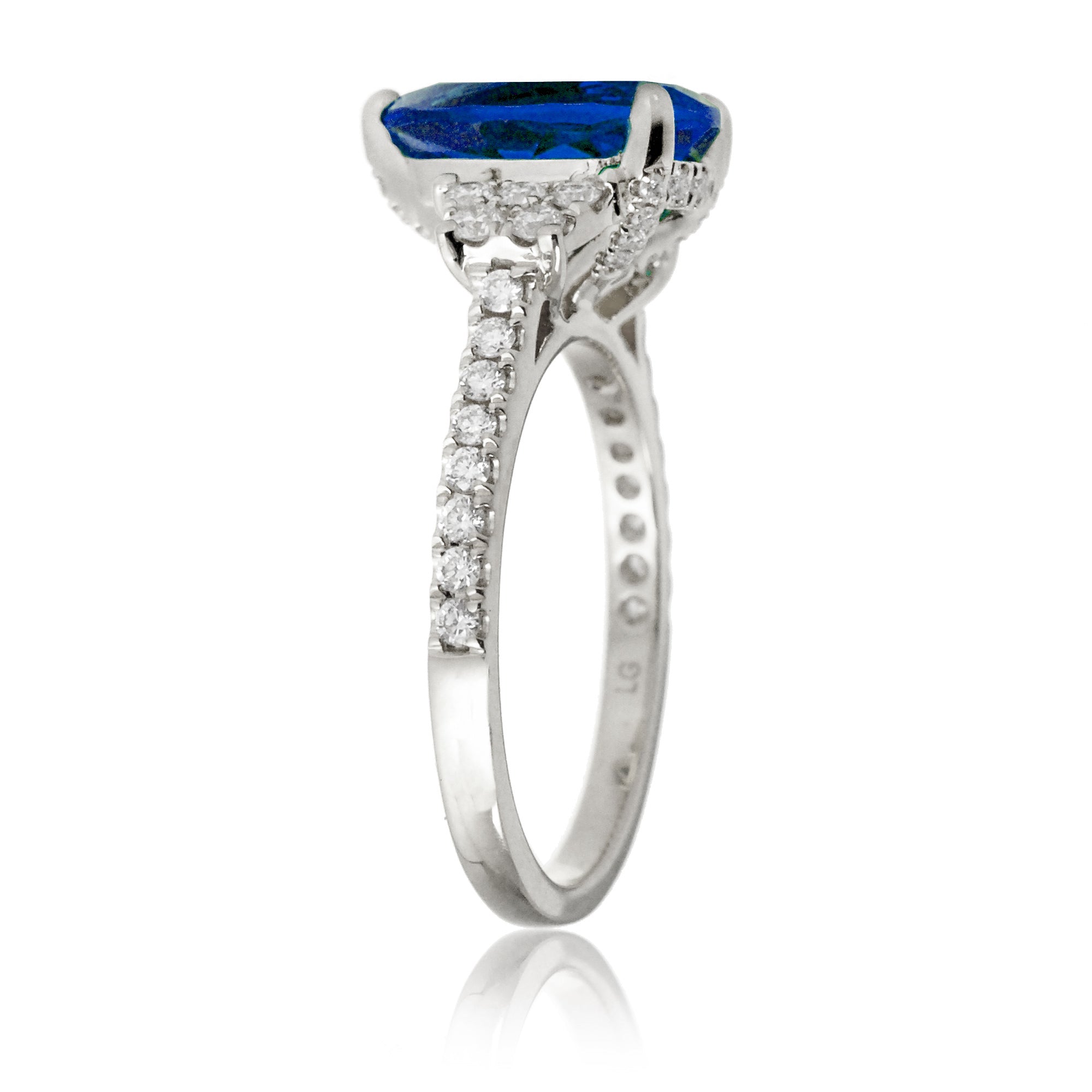 Pear blue sapphire and diamond band engagement ring in white gold
