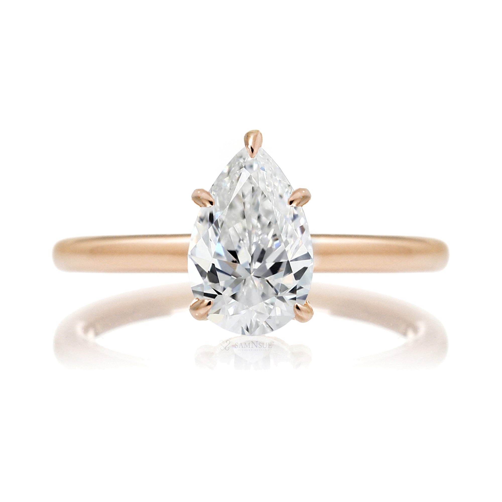 Pear cut solitaire diamond engagement ring with a hidden halo and solid polished band in rose gold