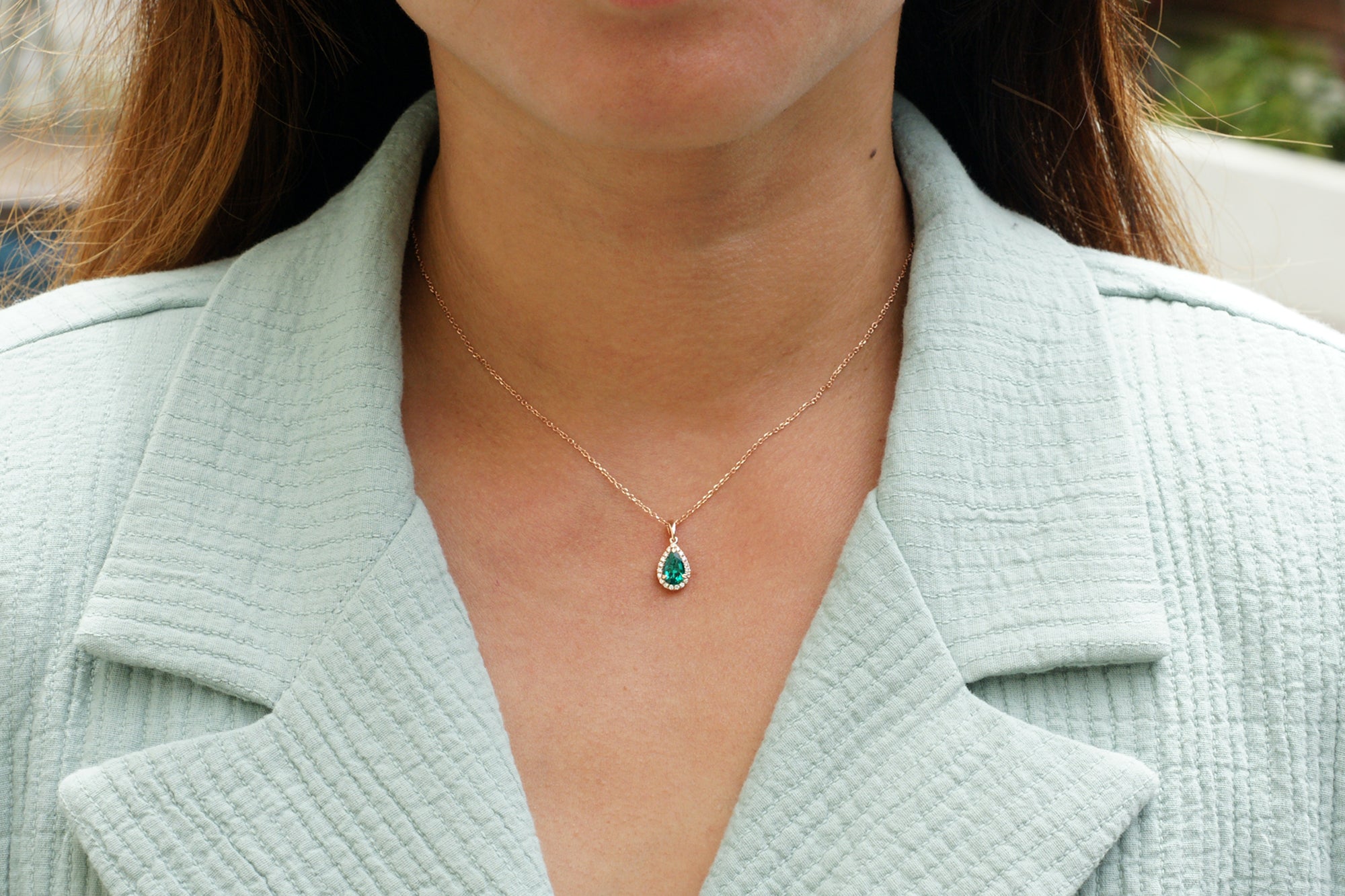 Pear green emerald pendant with diamond halo rose gold