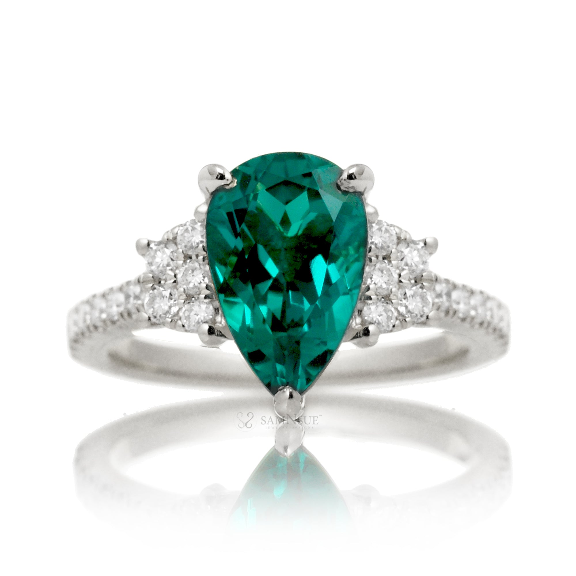 Pear emerald diamond three stone ring in white gold the Taylor