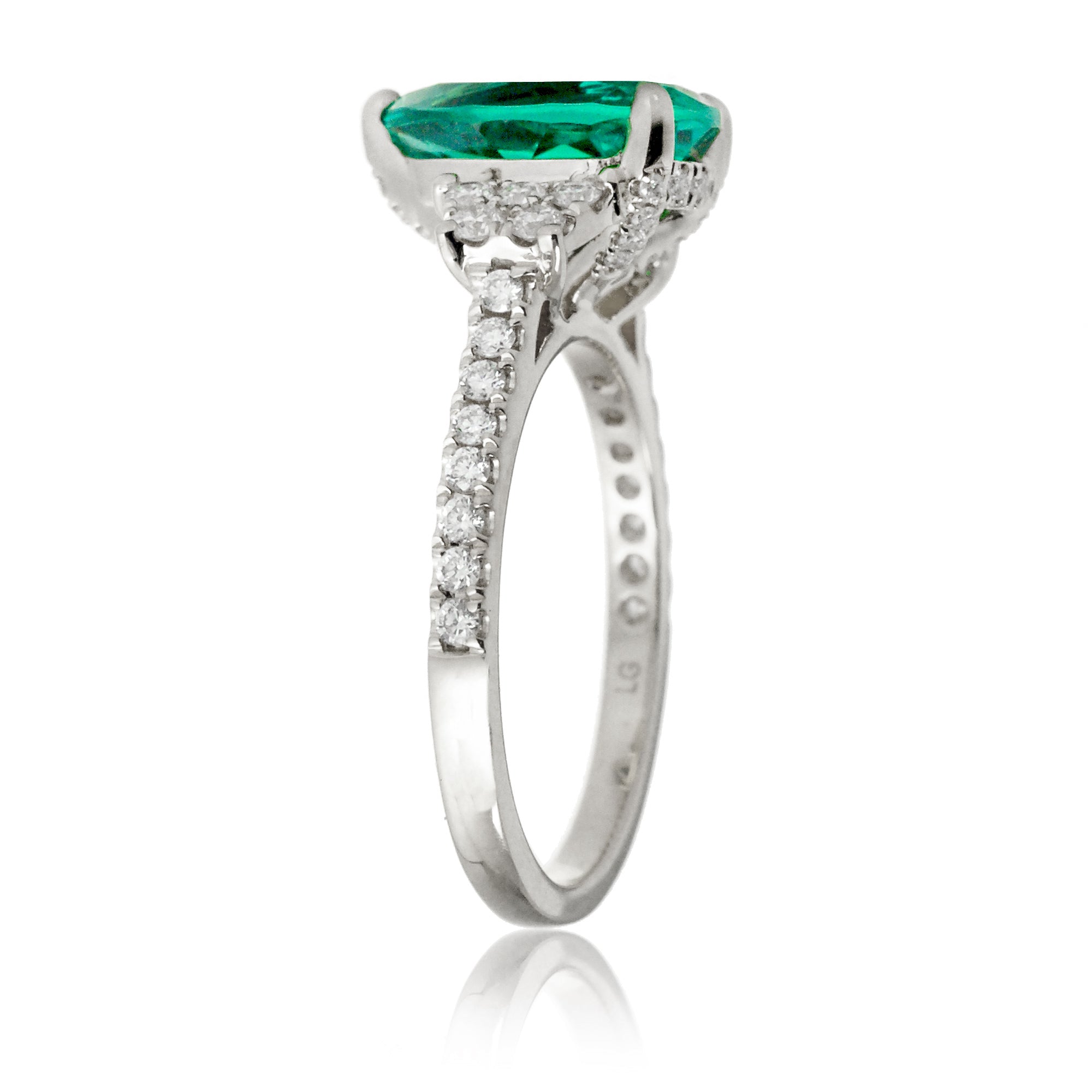 Pear emerald diamond three stone ring in white gold the Taylor
