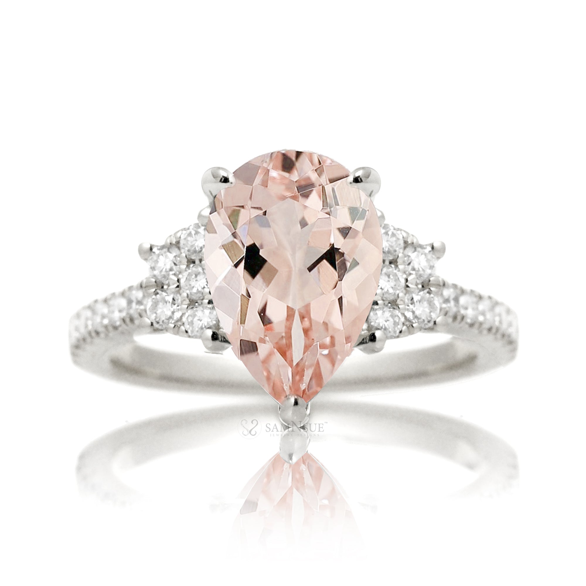 Pear morganite engagement ring with diamond accent in a trapezoid shape in white gold