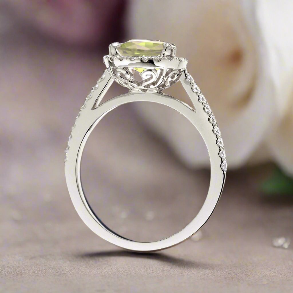 Pear yellow sapphire engagement ring with diamond halo
