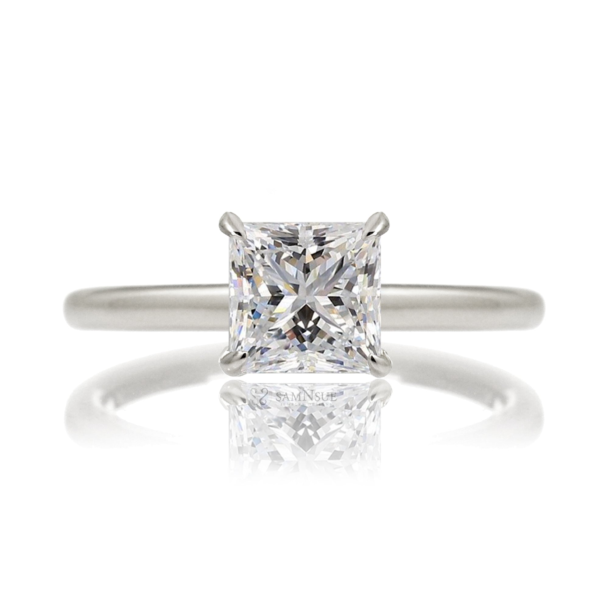 Princess cut solitaire diamond engagement ring with a hidden halo and solid polished band in white gold