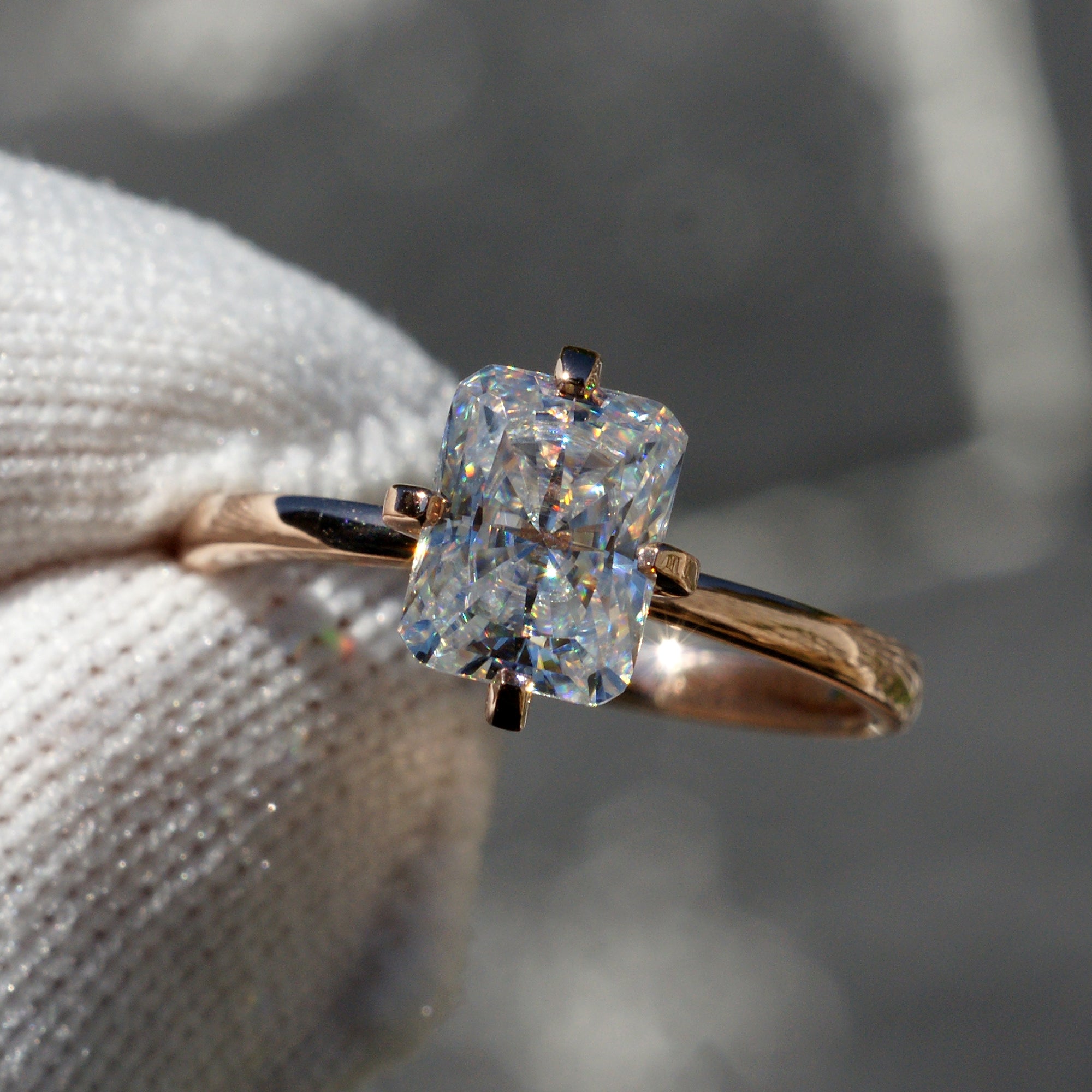 Radiant cut moissanite solitaire engagement ring in rose gold