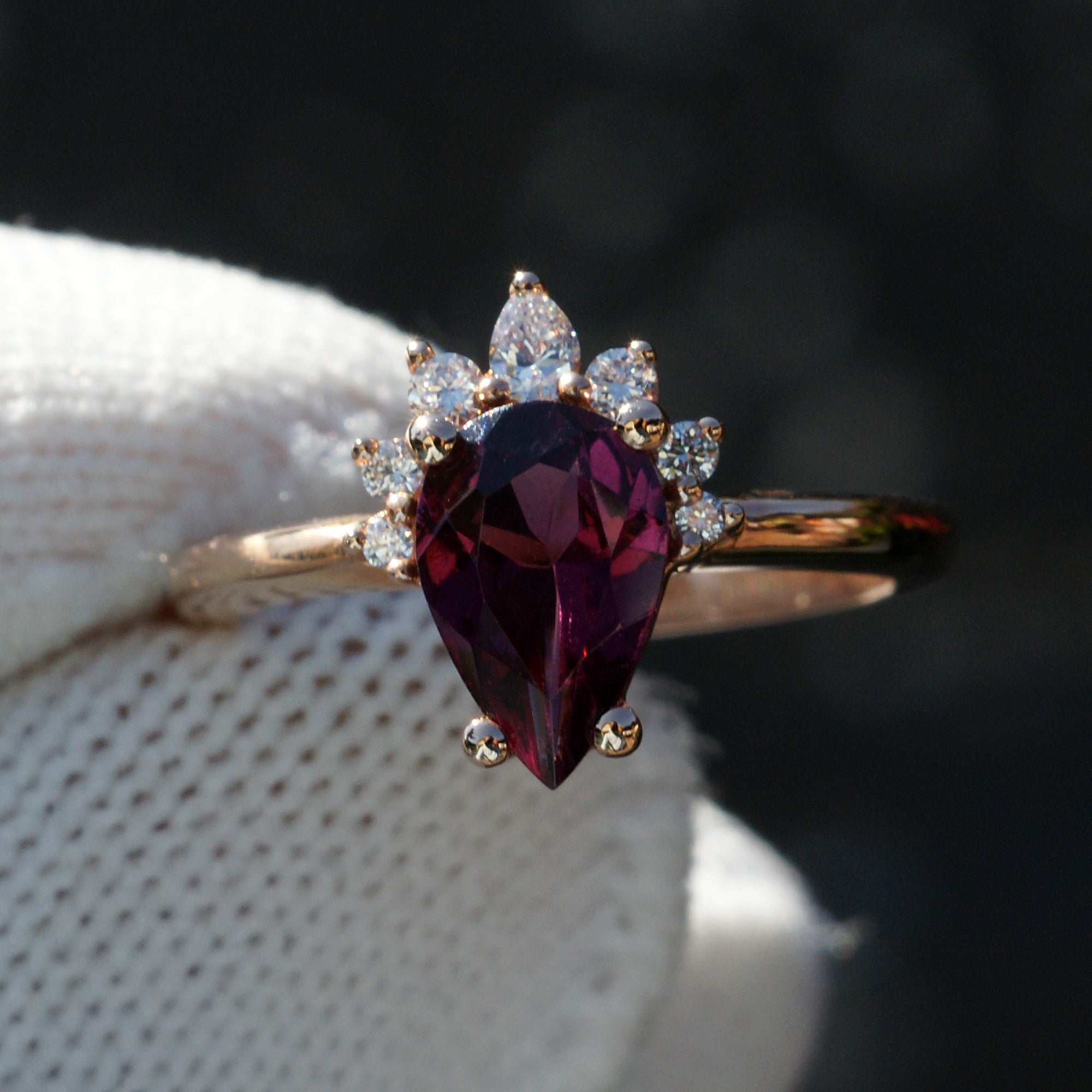 Rhodolite garnet pear half diamond halo ring in rose gold