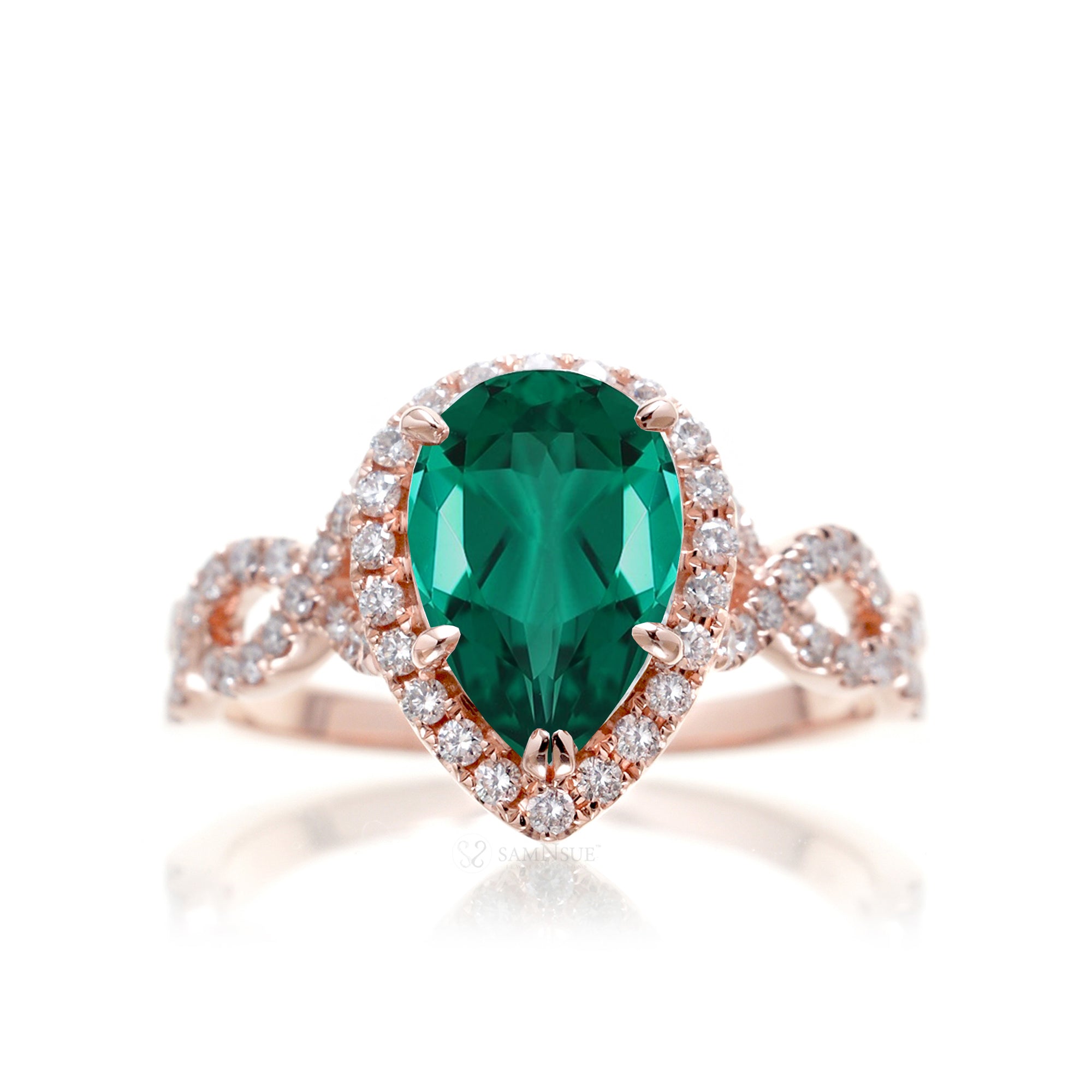 pear emerald diamond halo ring with twisted band rose gold