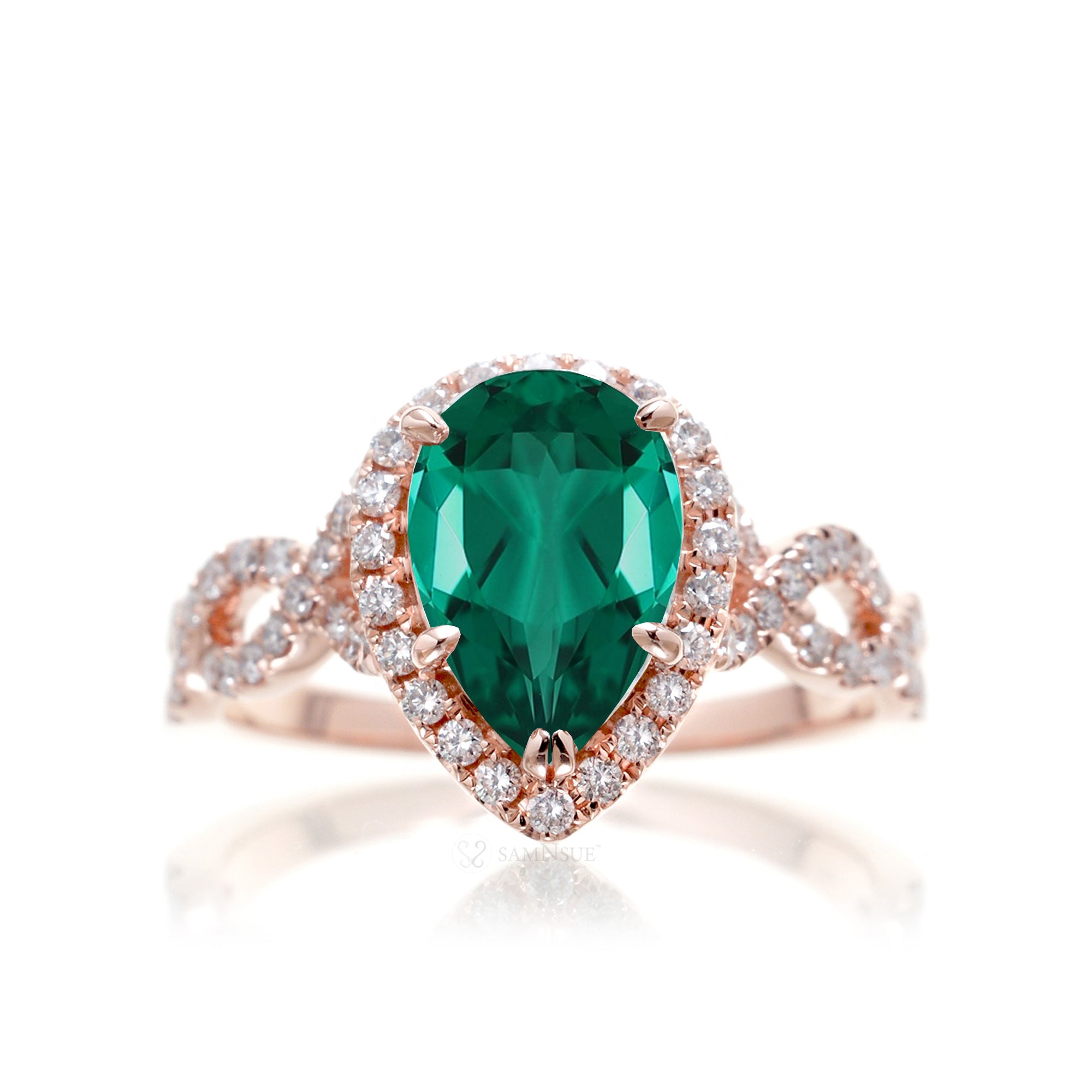 pear emerald diamond halo ring with twisted band rose gold