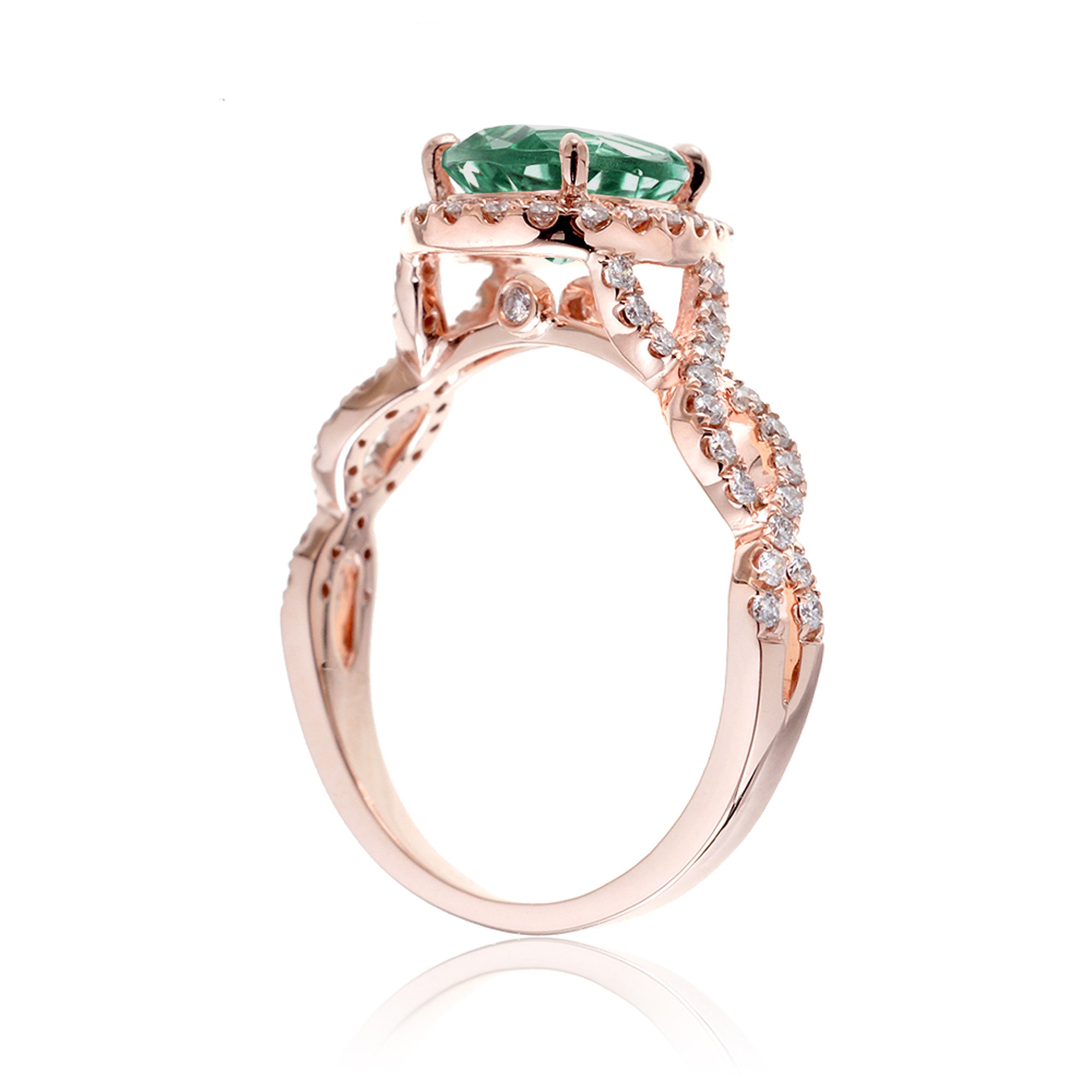 pear emerald diamond halo ring with twisted band rose gold