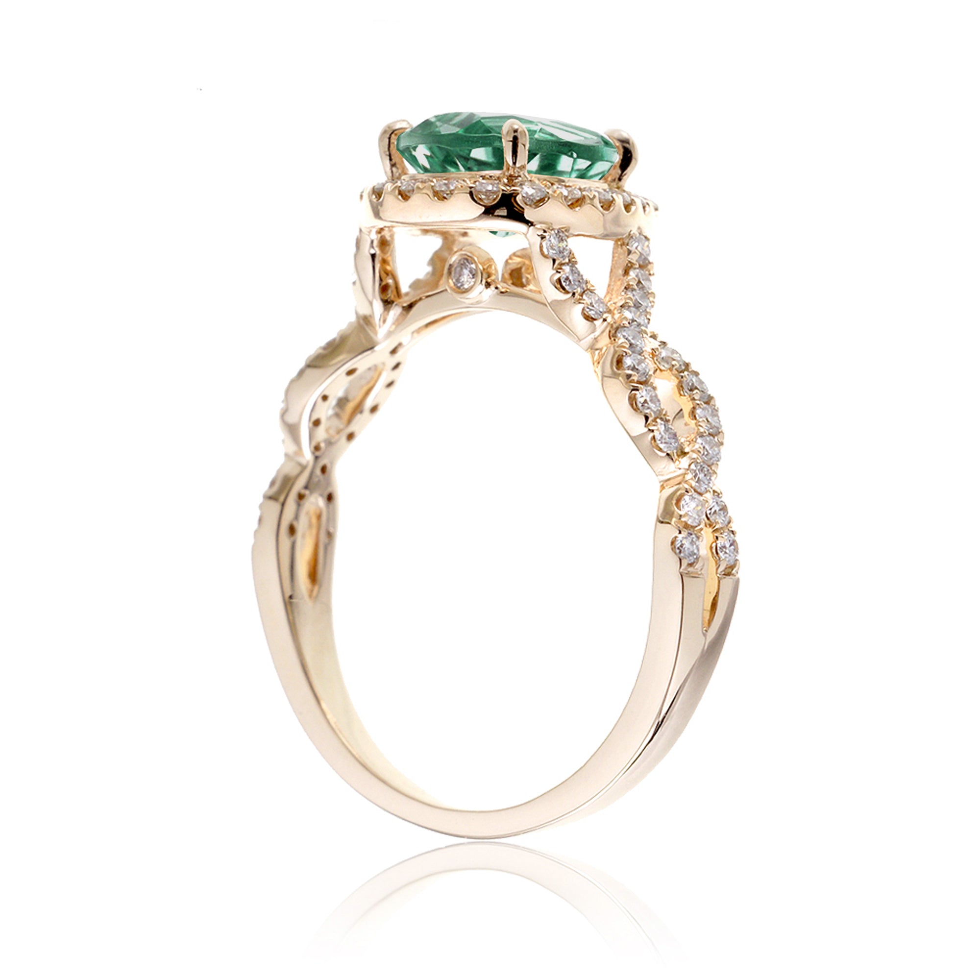 pear emerald diamond halo ring with twisted band yellow gold