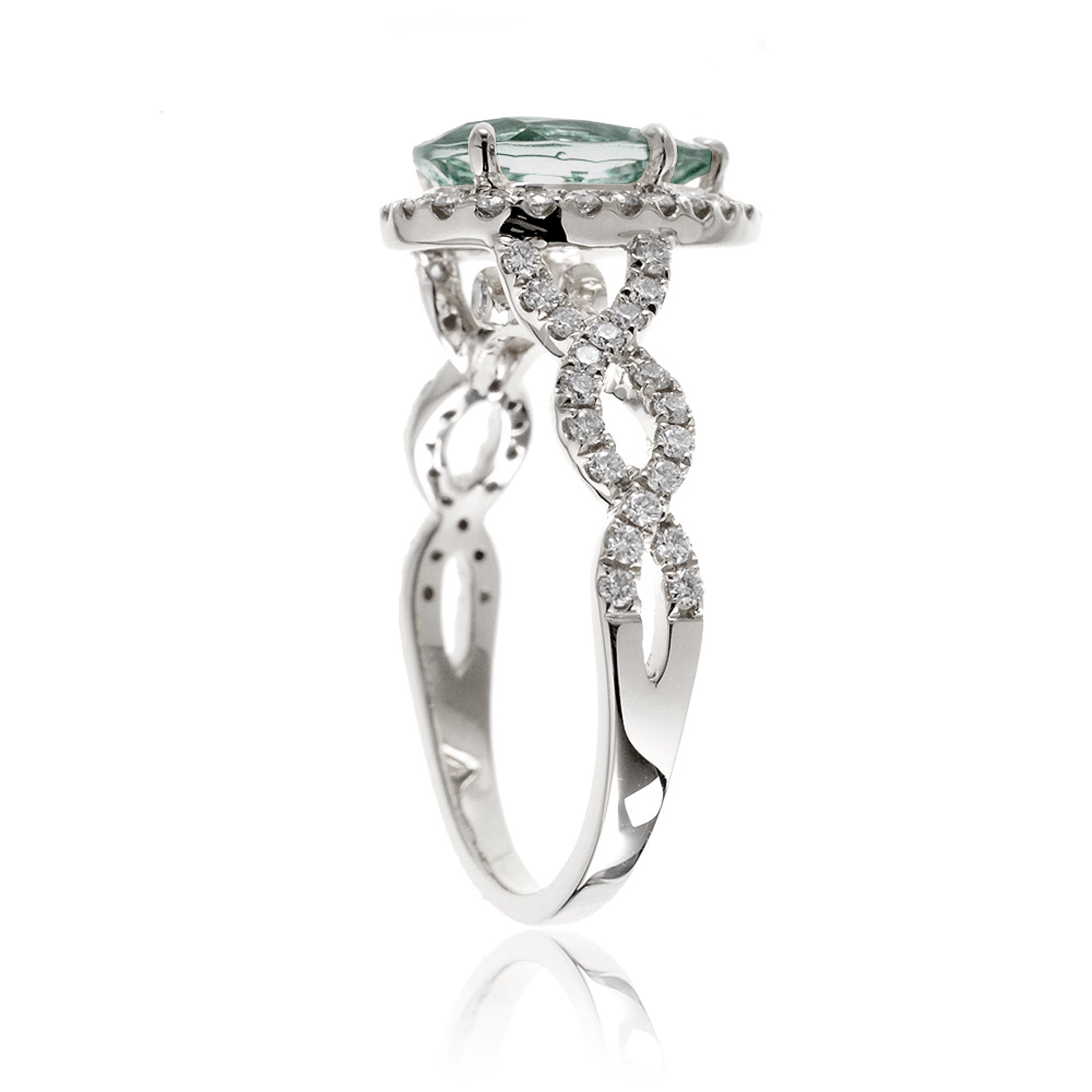 Twist band diamond halo ring with pear green sapphire white gold