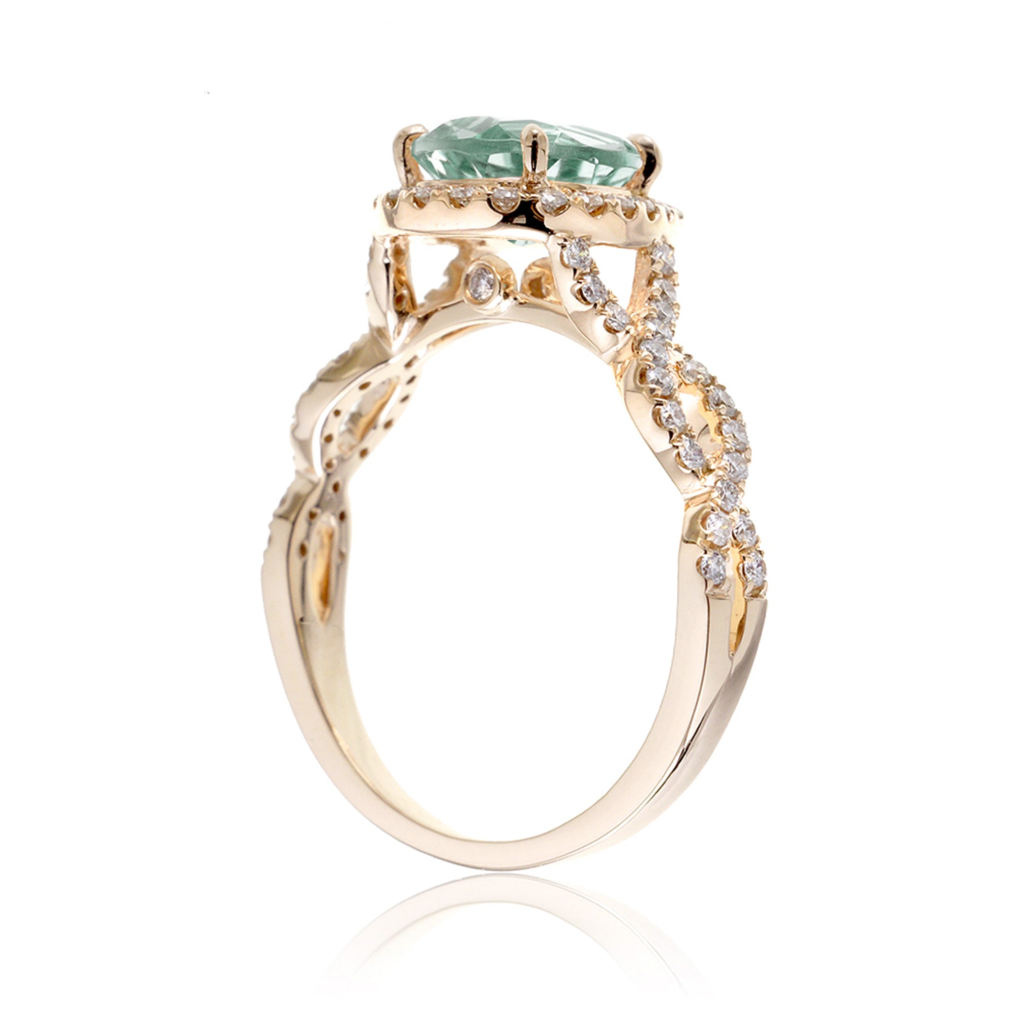 Twist band diamond halo ring with pear green sapphire yellow gold