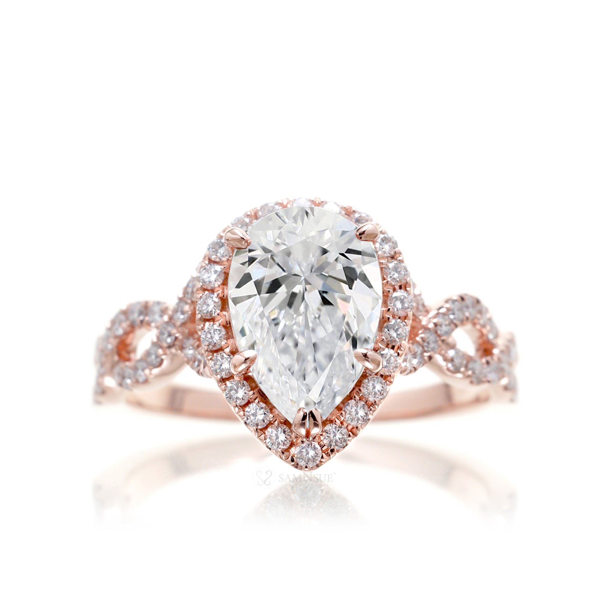 Pear diamond engagement ring halo and twist band rose gold