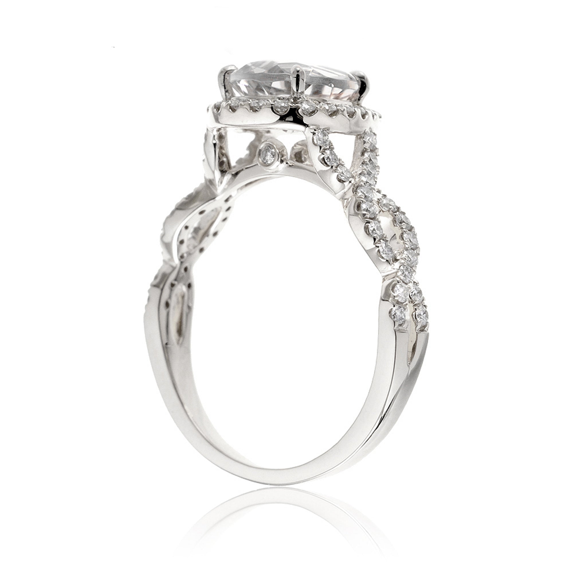 Pear diamond engagement ring halo and twist band white gold