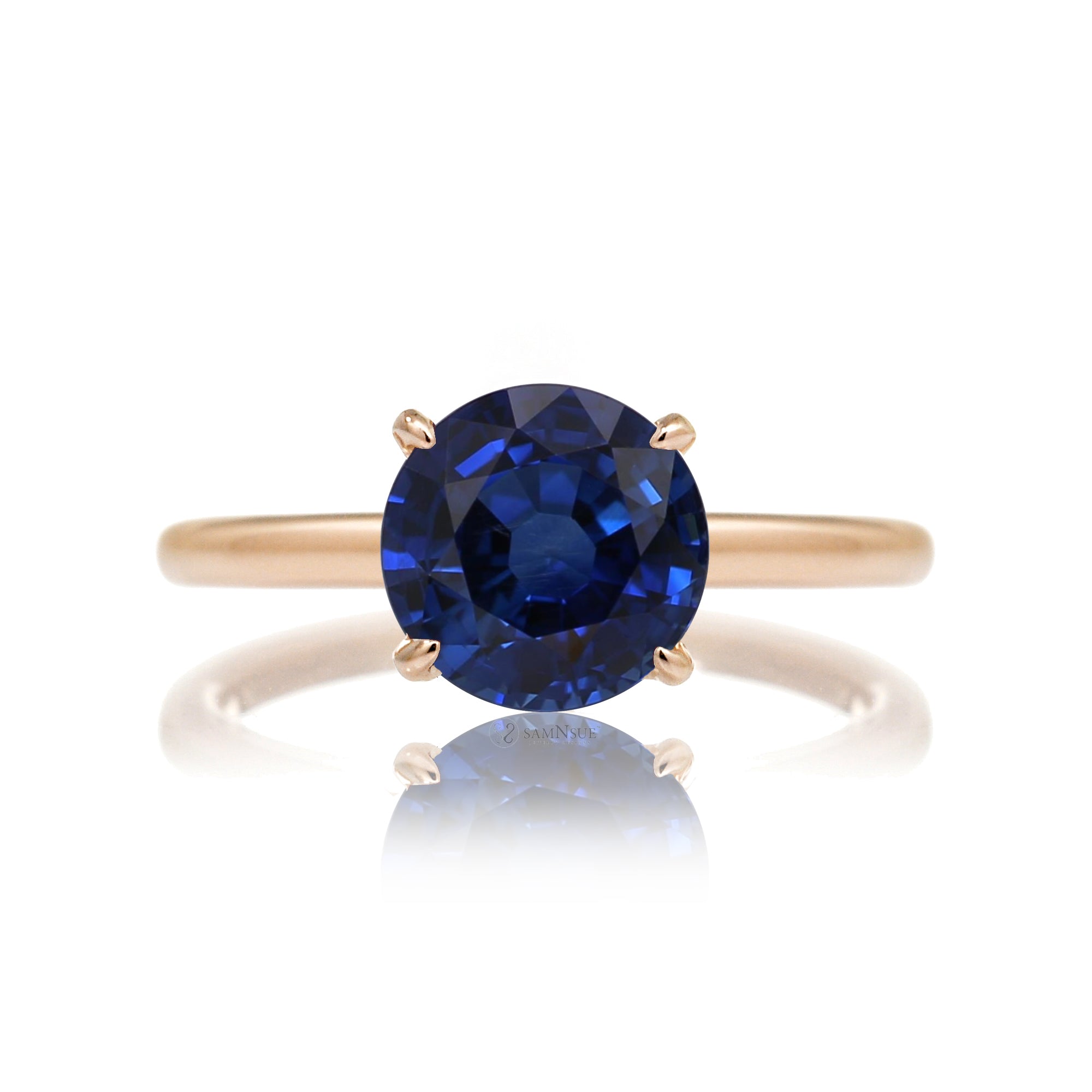 Round cut blue lab-grown sapphire with diamond hidden halo on rose gold