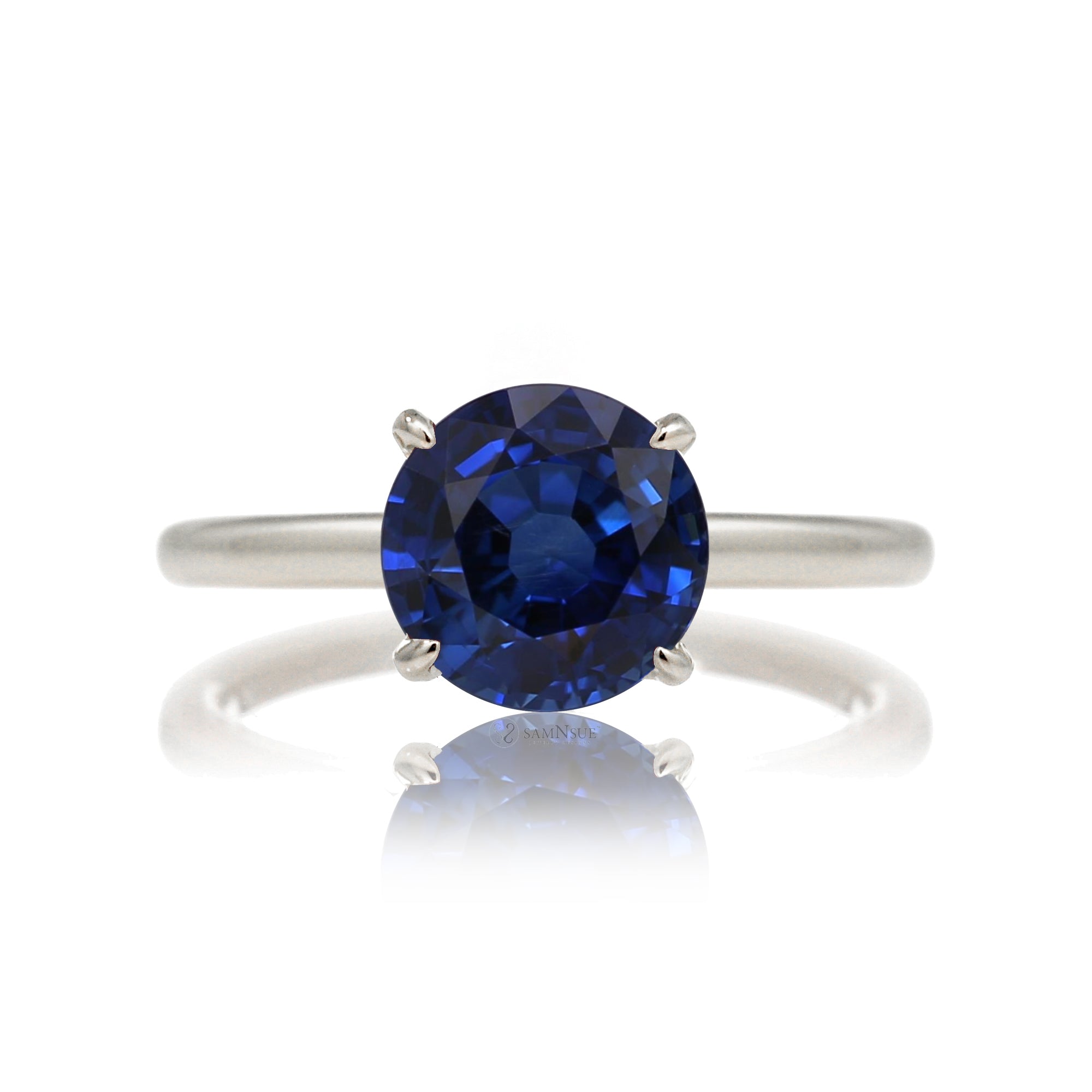 Round cut blue lab-grown sapphire with diamond hidden halo on white gold