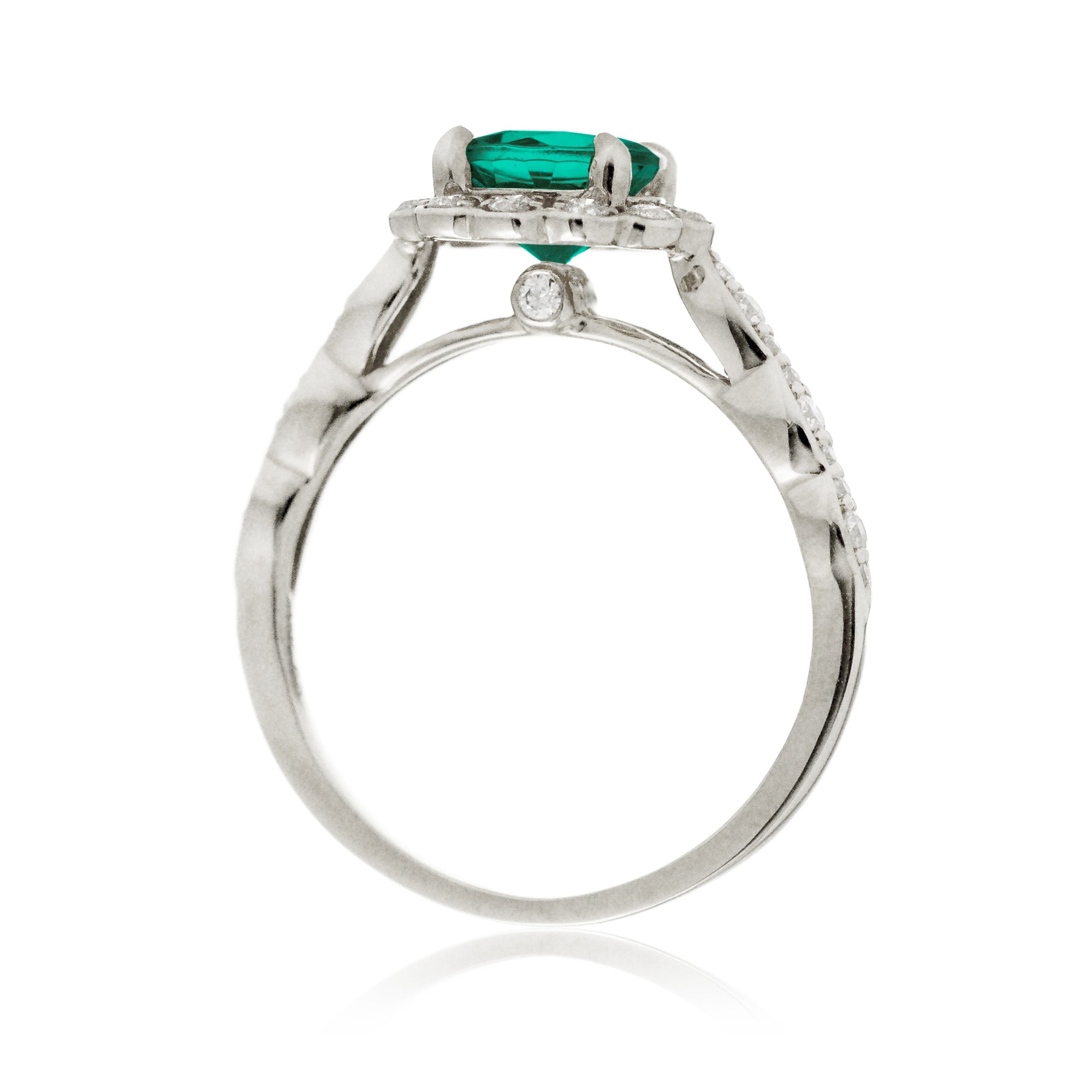 Round emerald engagement ring with scallop halo in white gold