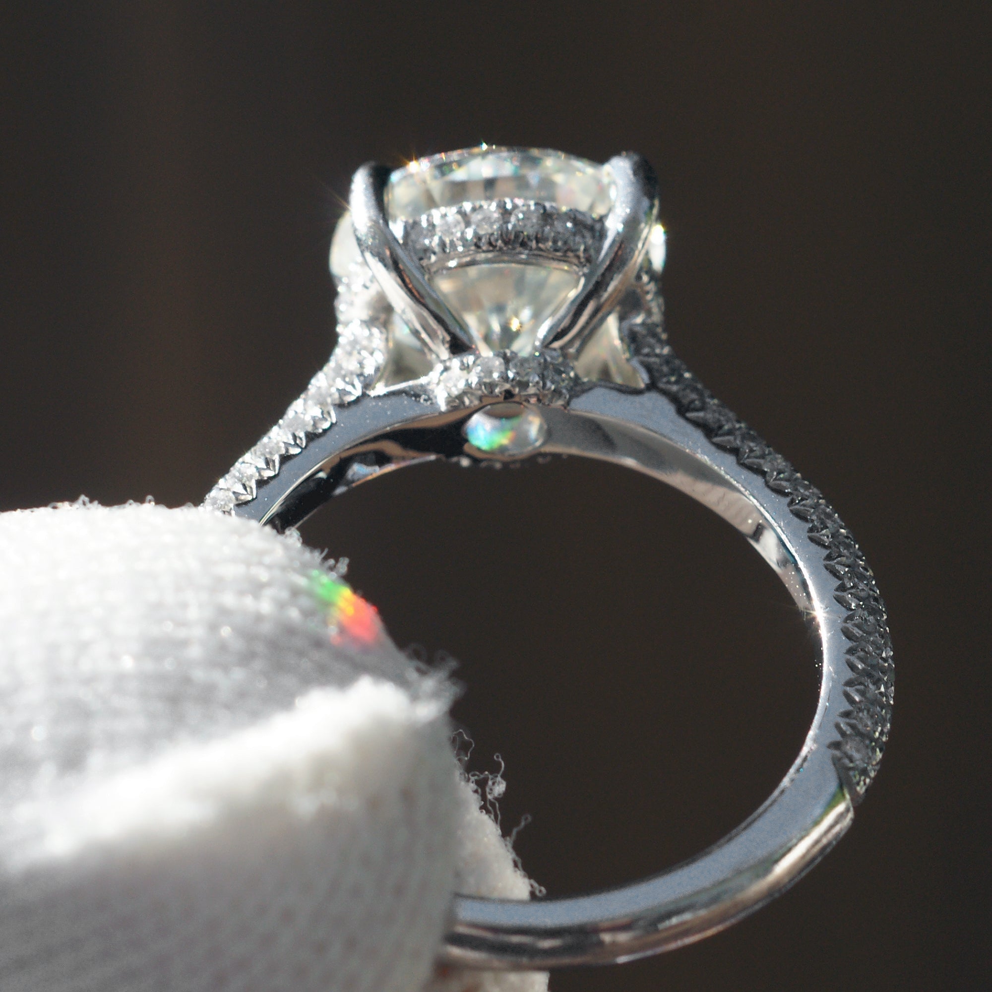Moissanite engagement ring round cut platinum starlight setting