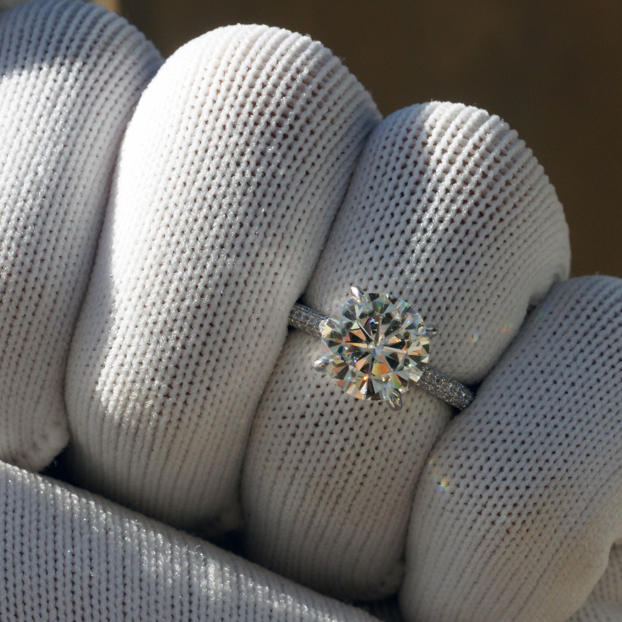 Moissanite engagement ring round cut platinum starlight setting