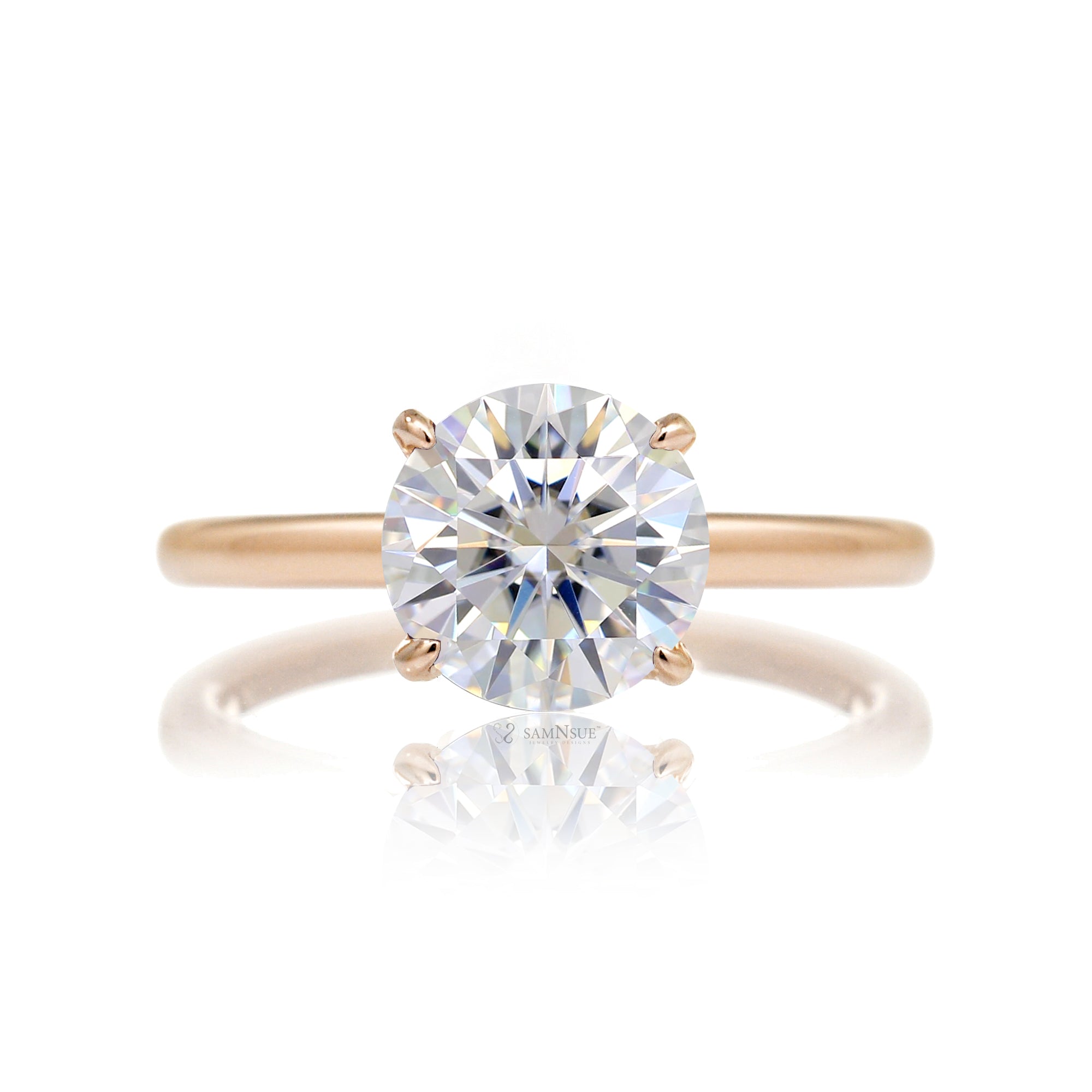 Round cut solitaire diamond engagement ring with a hidden halo and solid polished band in rose gold