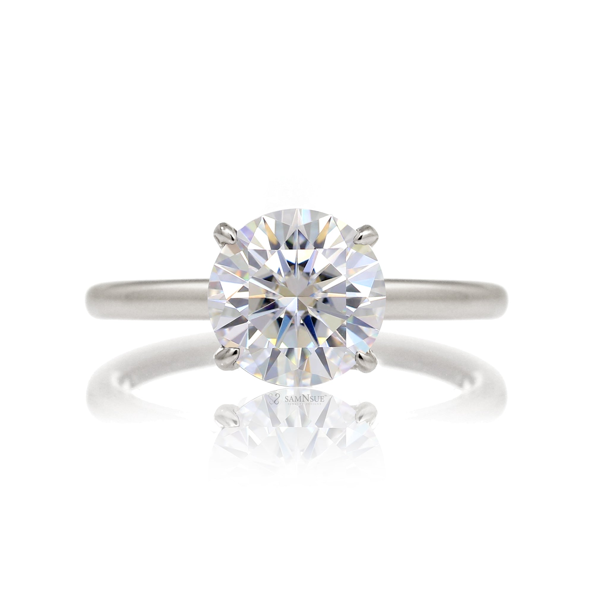 Round cut solitaire diamond engagement ring with a hidden halo and solid polished band in white gold