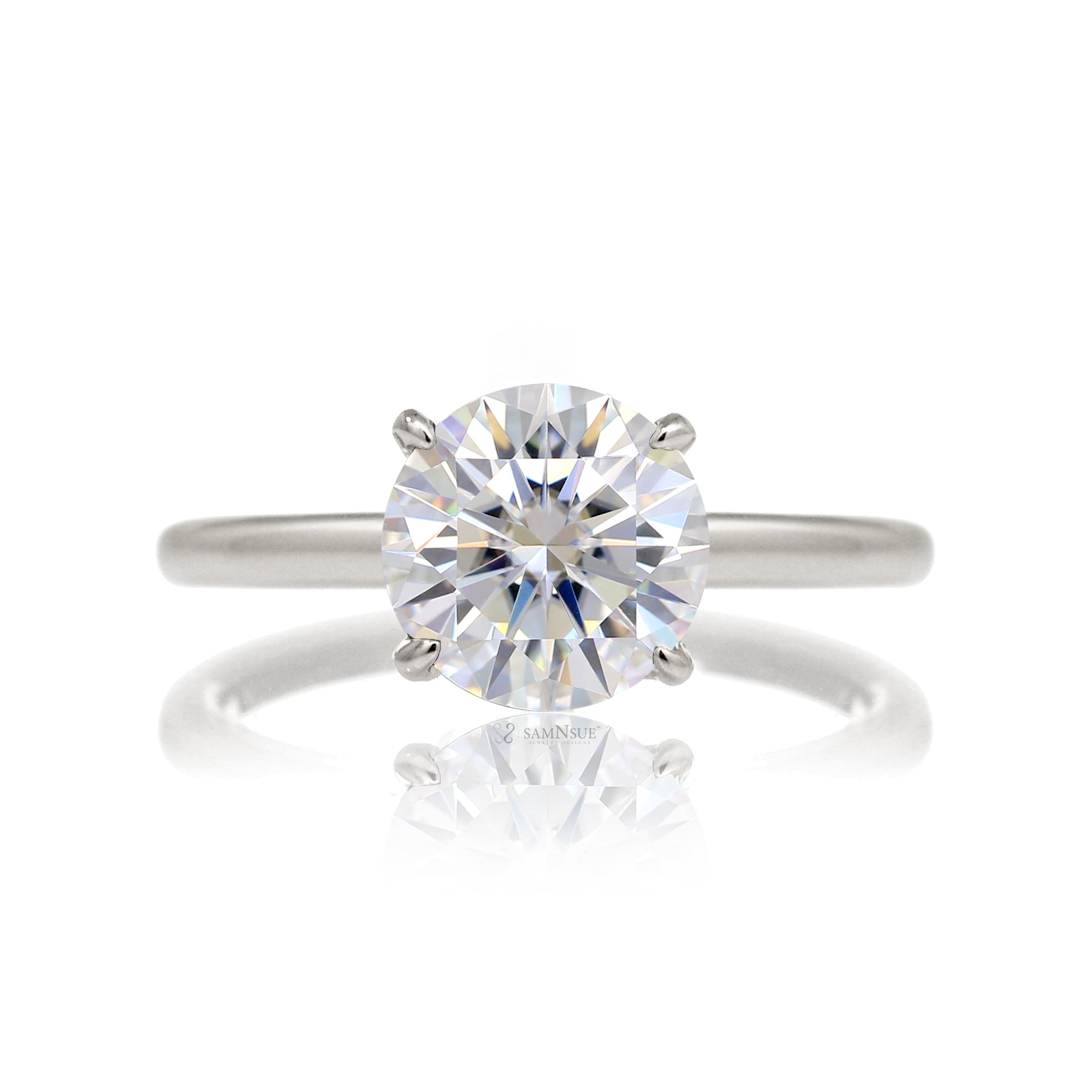 Round cut solitaire diamond engagement ring with a hidden halo and solid polished band in white  gold