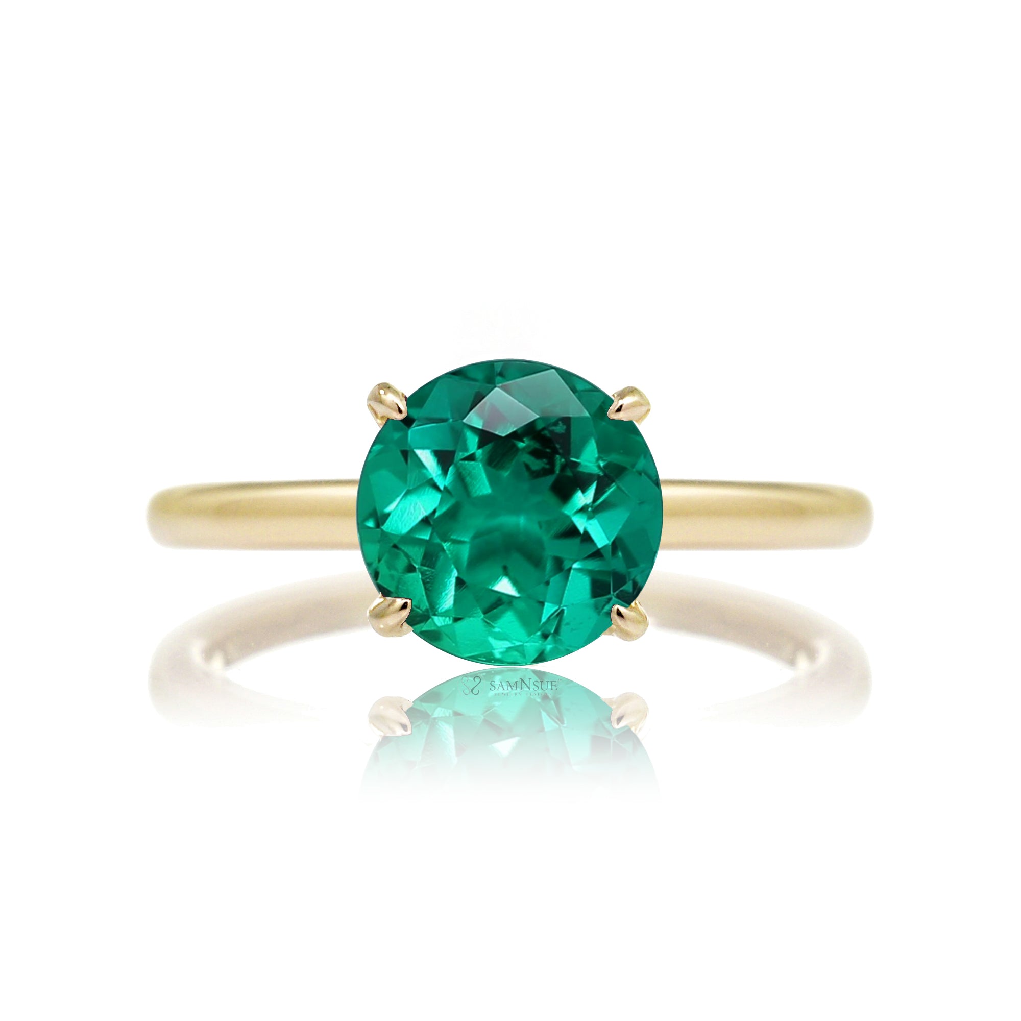Round cut green emerald ring with diamond hidden halo on yellow gold