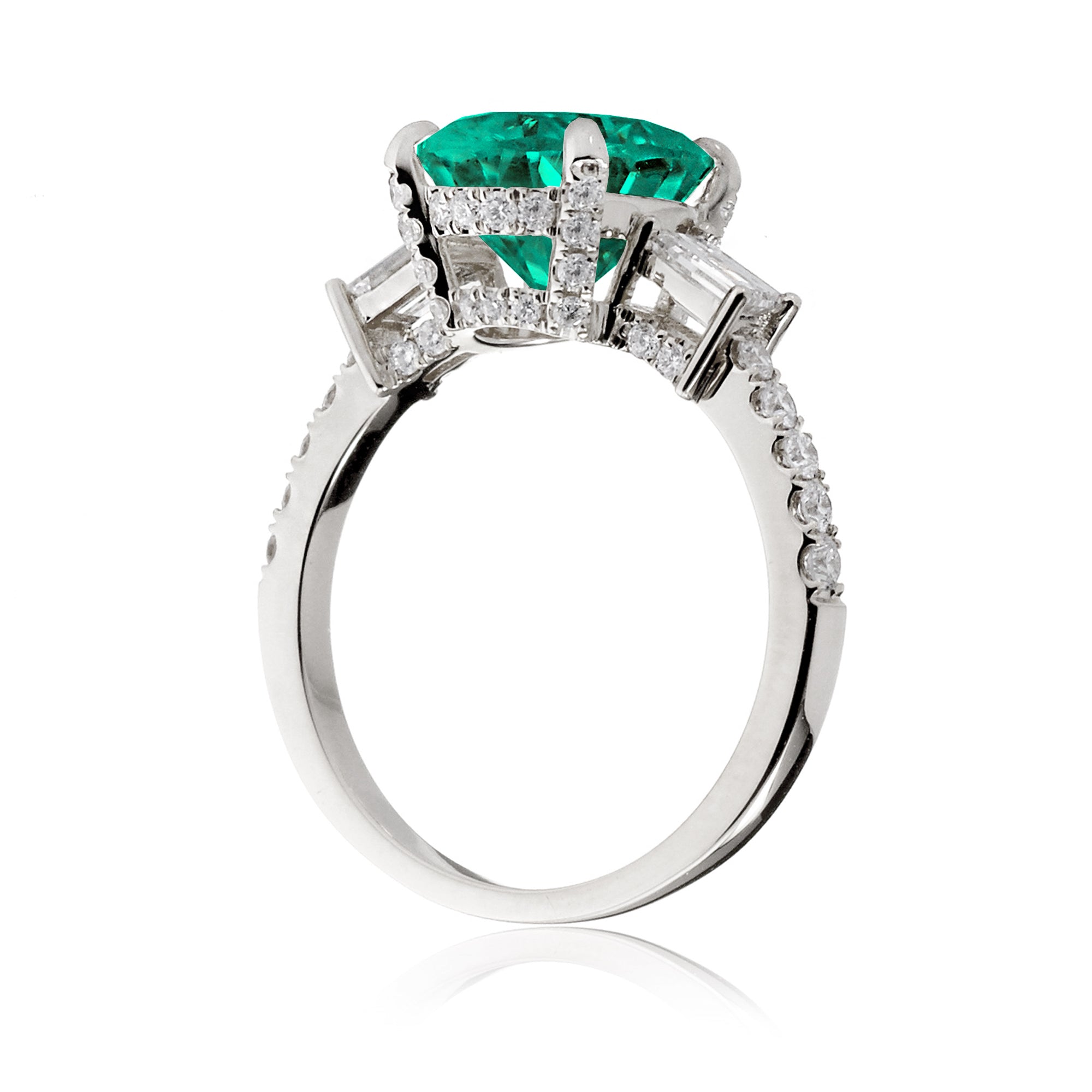 Green emerald three stone diamond baguette engagement ring white gold