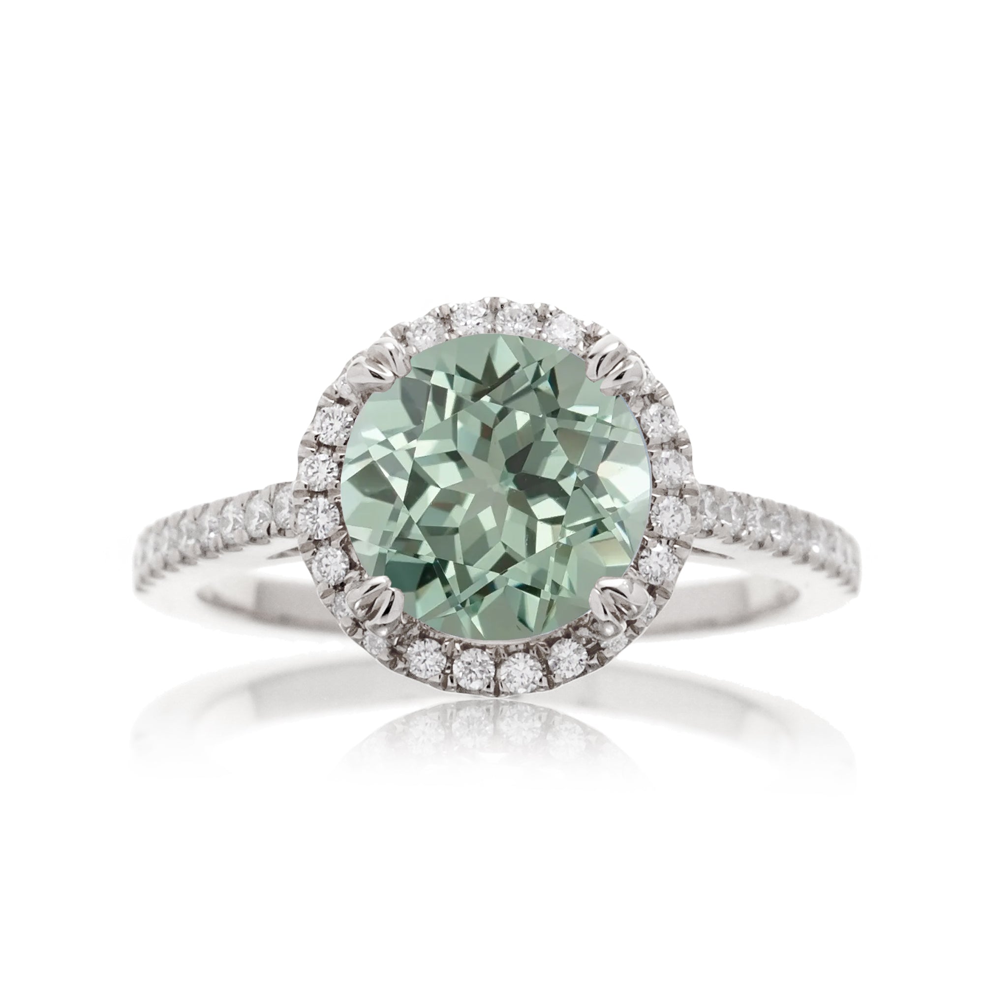 Round cut green sapphire diamond engagement ring with halo