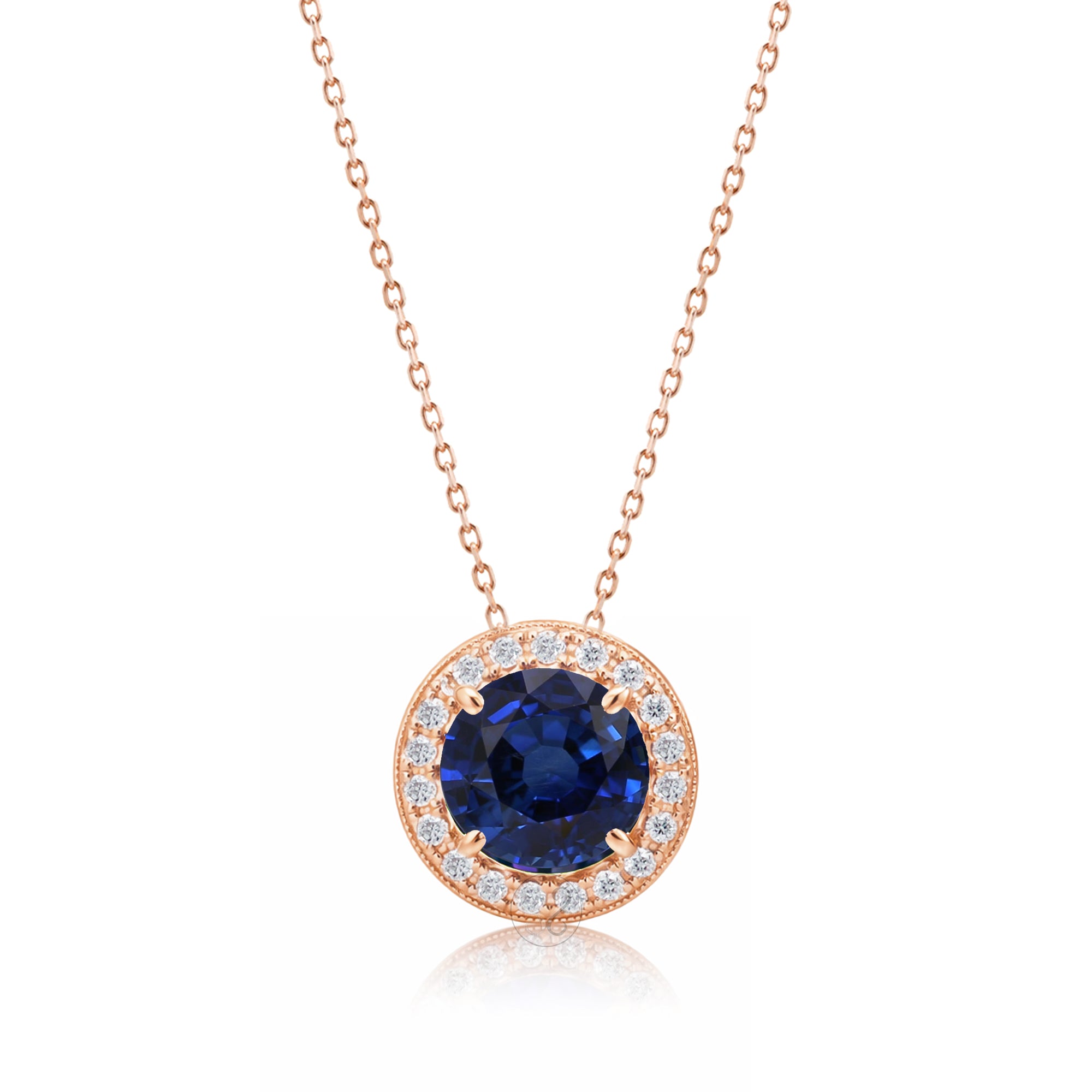 Blue sapphire pendant necklace with pave diamond halo with a cable chain in rose gold