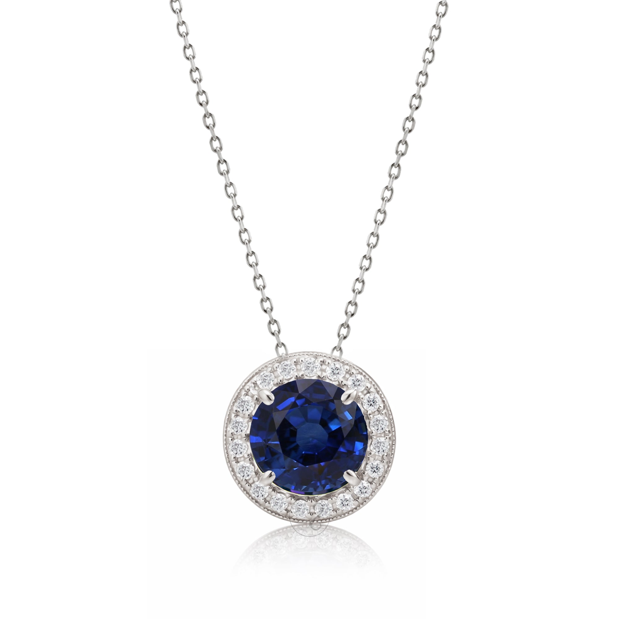 Blue sapphire pendant necklace with pave diamond halo with a cable chain in white gold