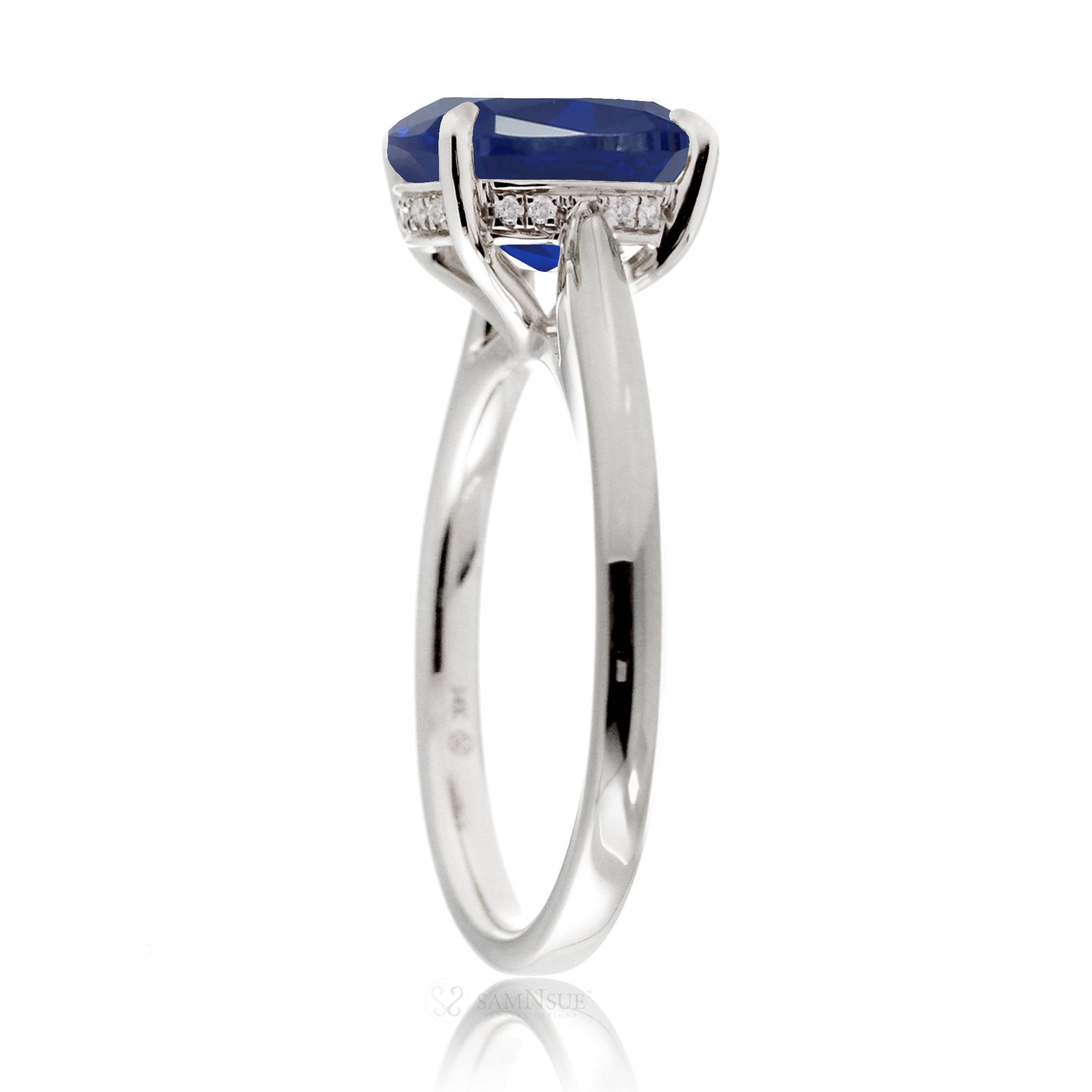 Round blue sapphire engagement ring with a solid band and hidden halo - the Emily white gold