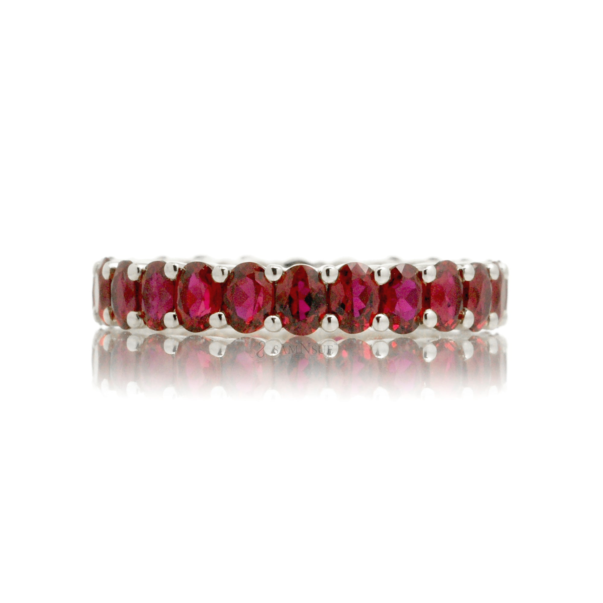 Ruby oval cut eternity wedding band white gold