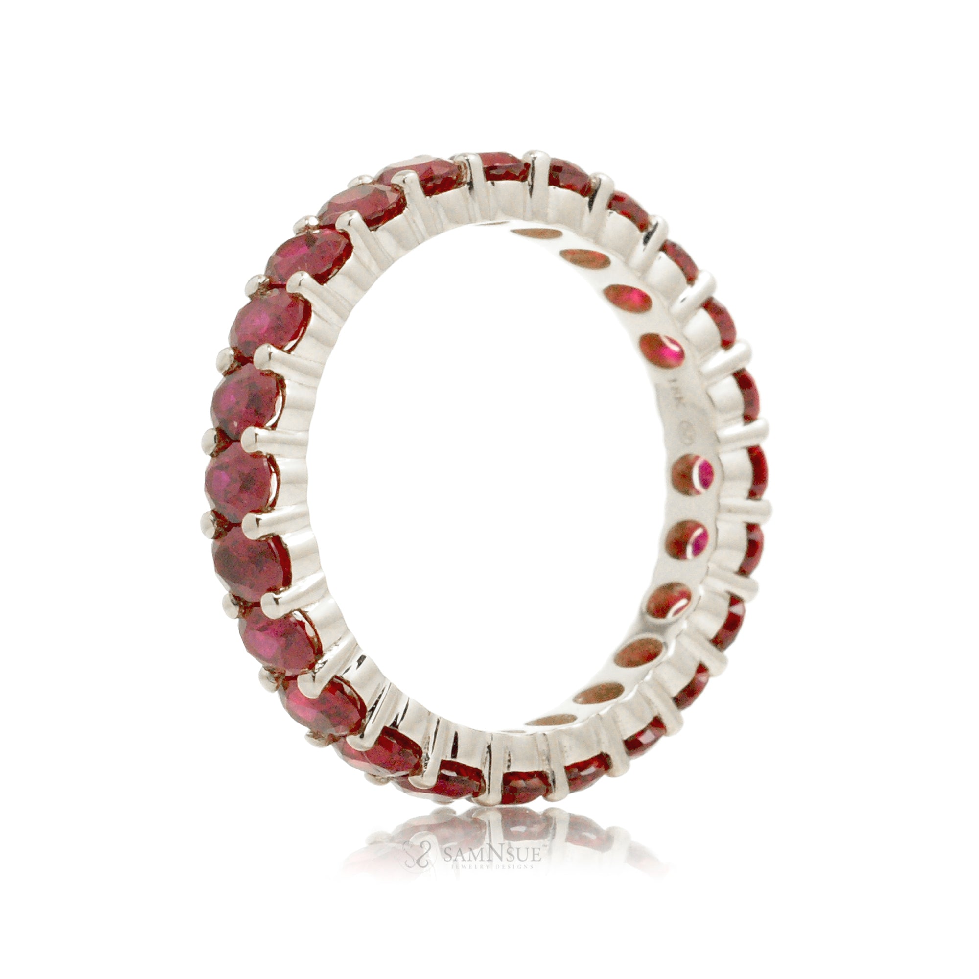 Ruby oval cut eternity wedding band white gold