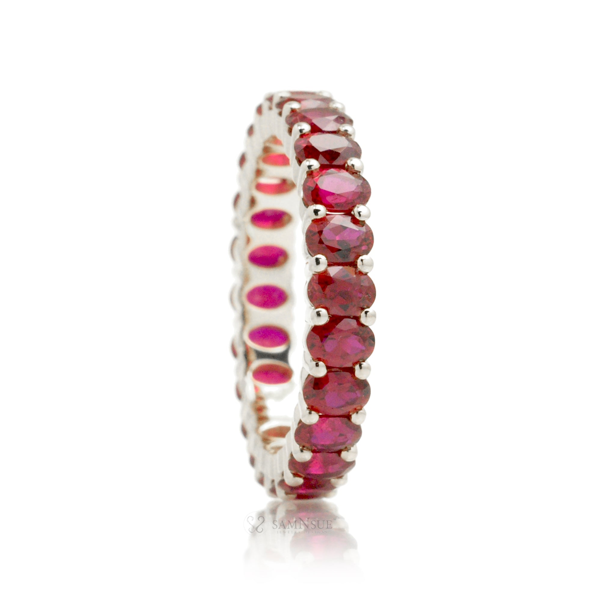 Ruby oval cut eternity wedding band white gold