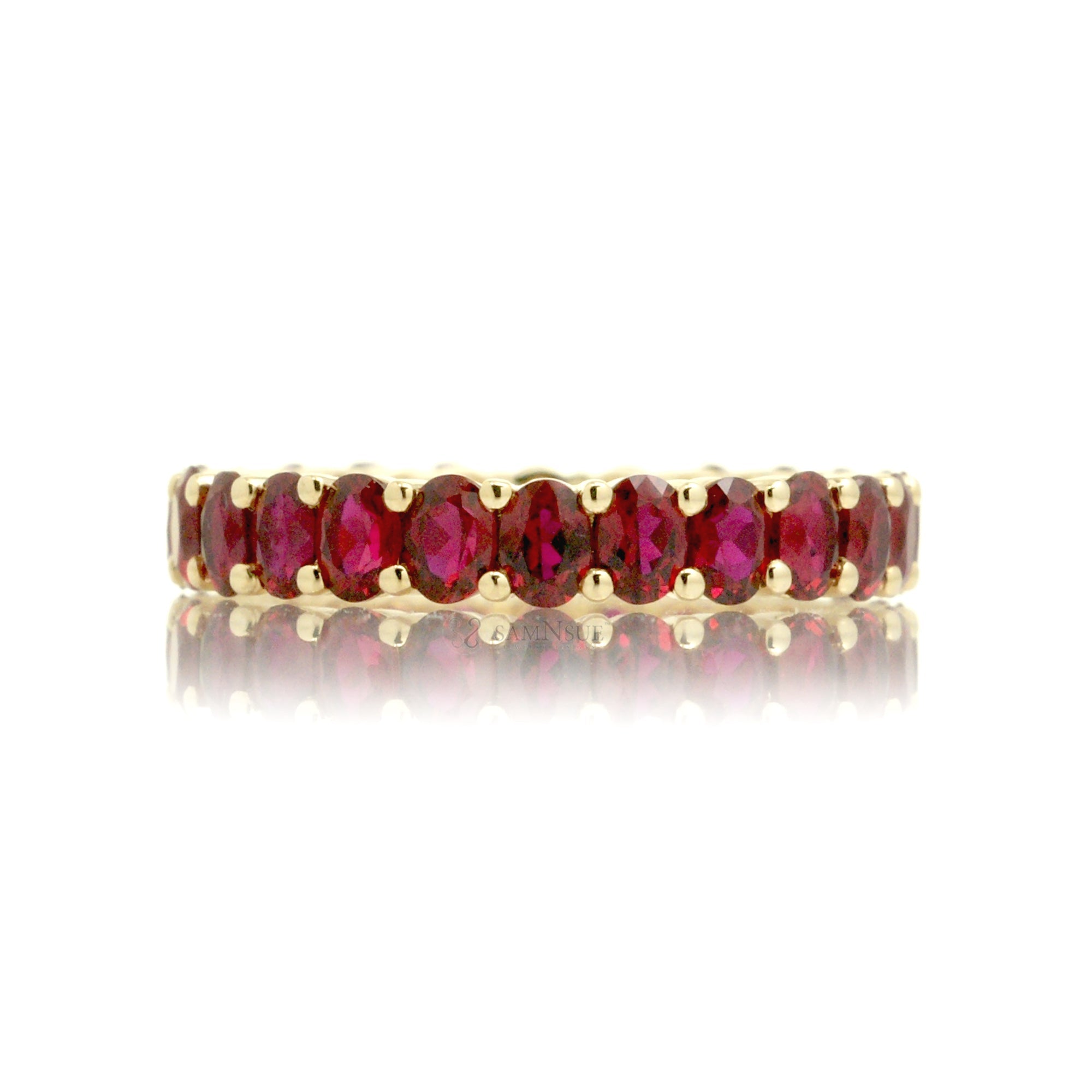 Ruby oval cut eternity wedding band yellow gold