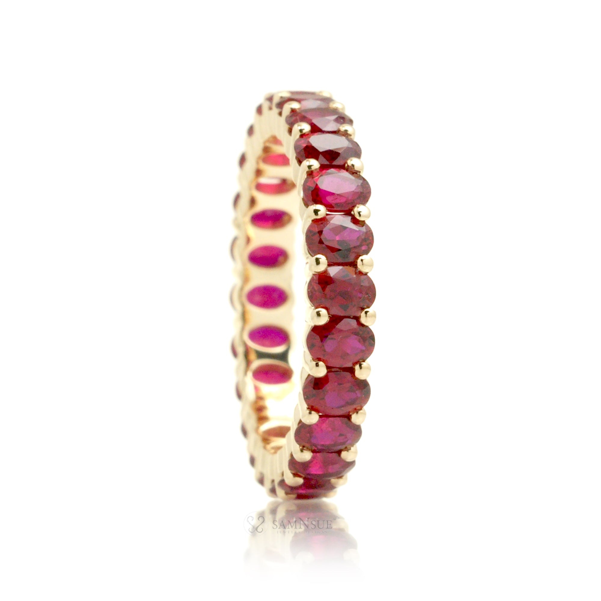 Ruby oval cut eternity wedding band yellow gold