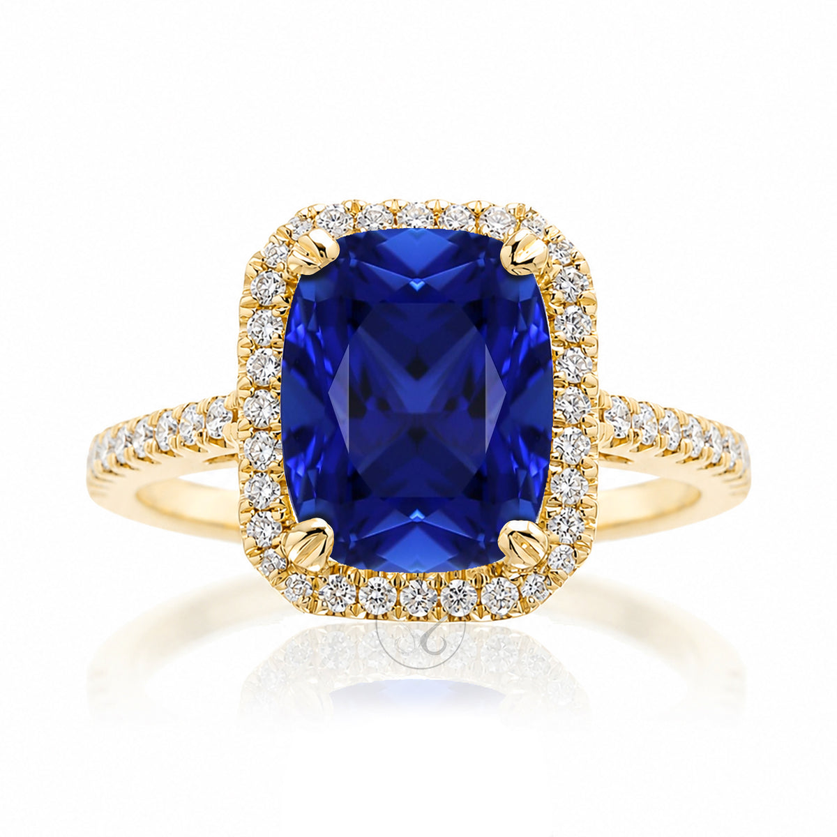 Cushion cut blue sapphire diamond halo ring The Signature in yellow gold